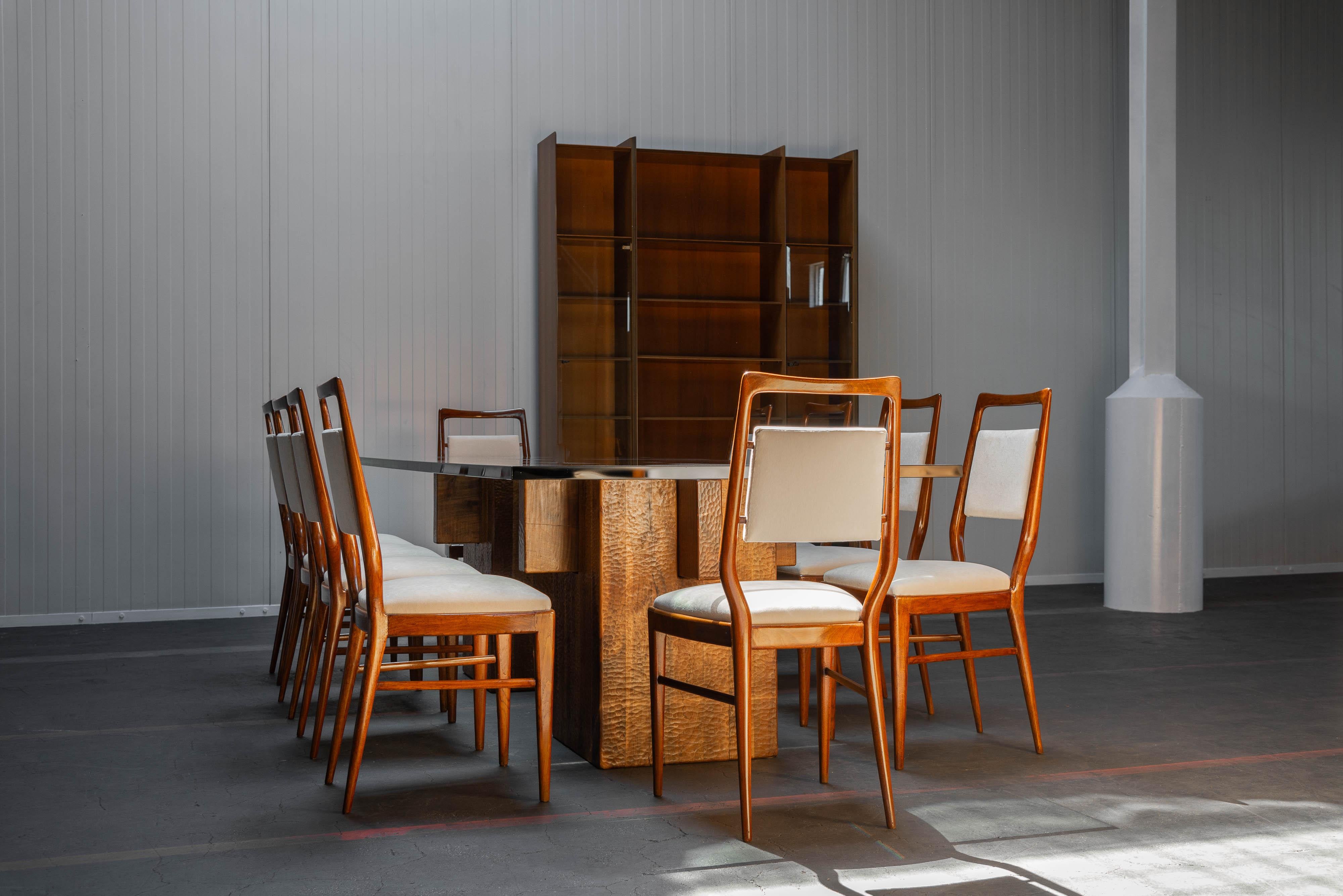 Unique Vittorio Dassi dining chairs manufactured in Italy 1950. These chairs feature beautifully shaped teak frames and the seats have been re-upholstered in a soft cream velvet fabric. The standout feature of these chairs is their unique design,