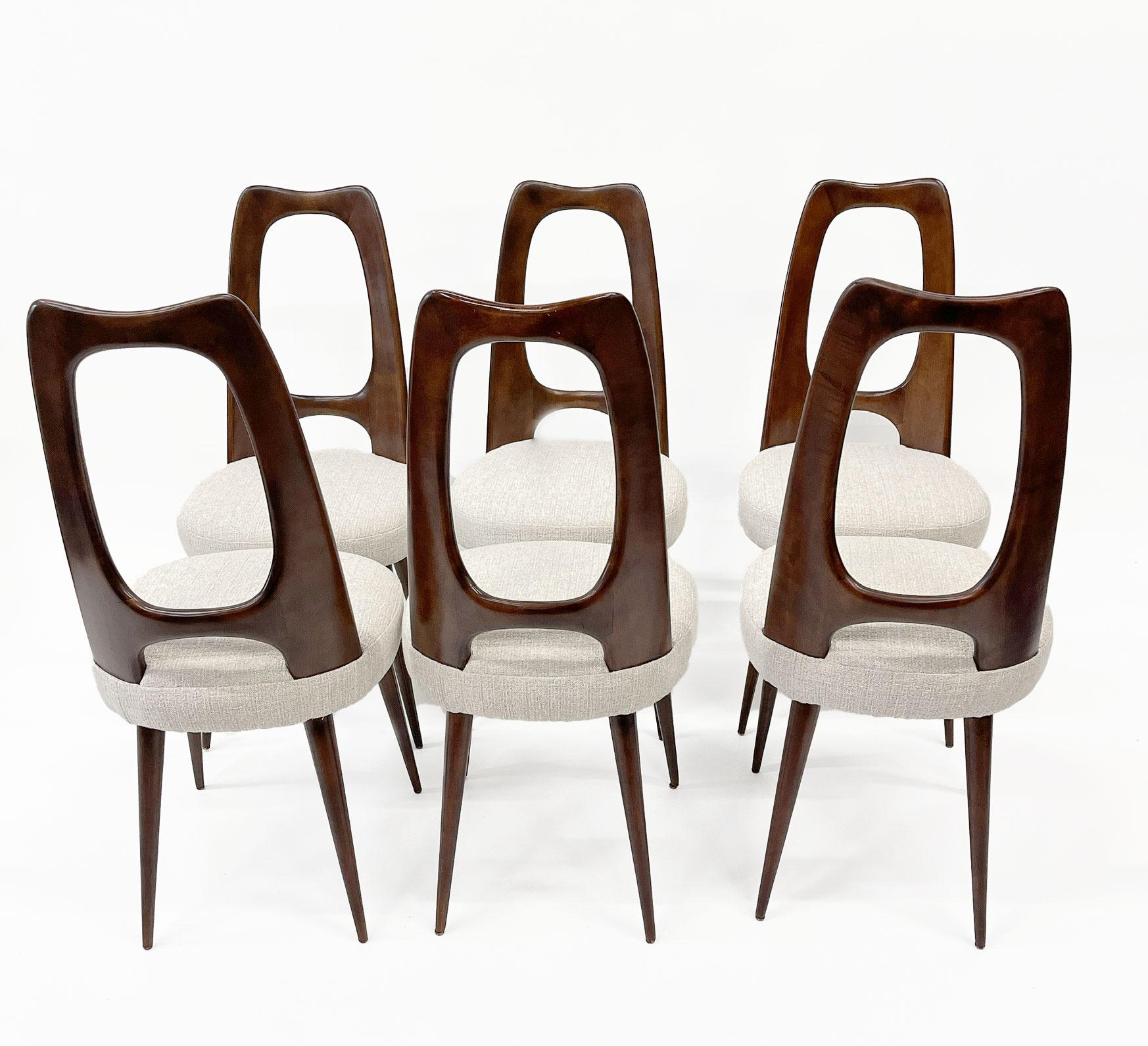 Six dining chairs designed by the famous Italian architect Vittorio Dassi, solid mahogany chairs and reupholstery in a Dedar fabric, in excellent condition.