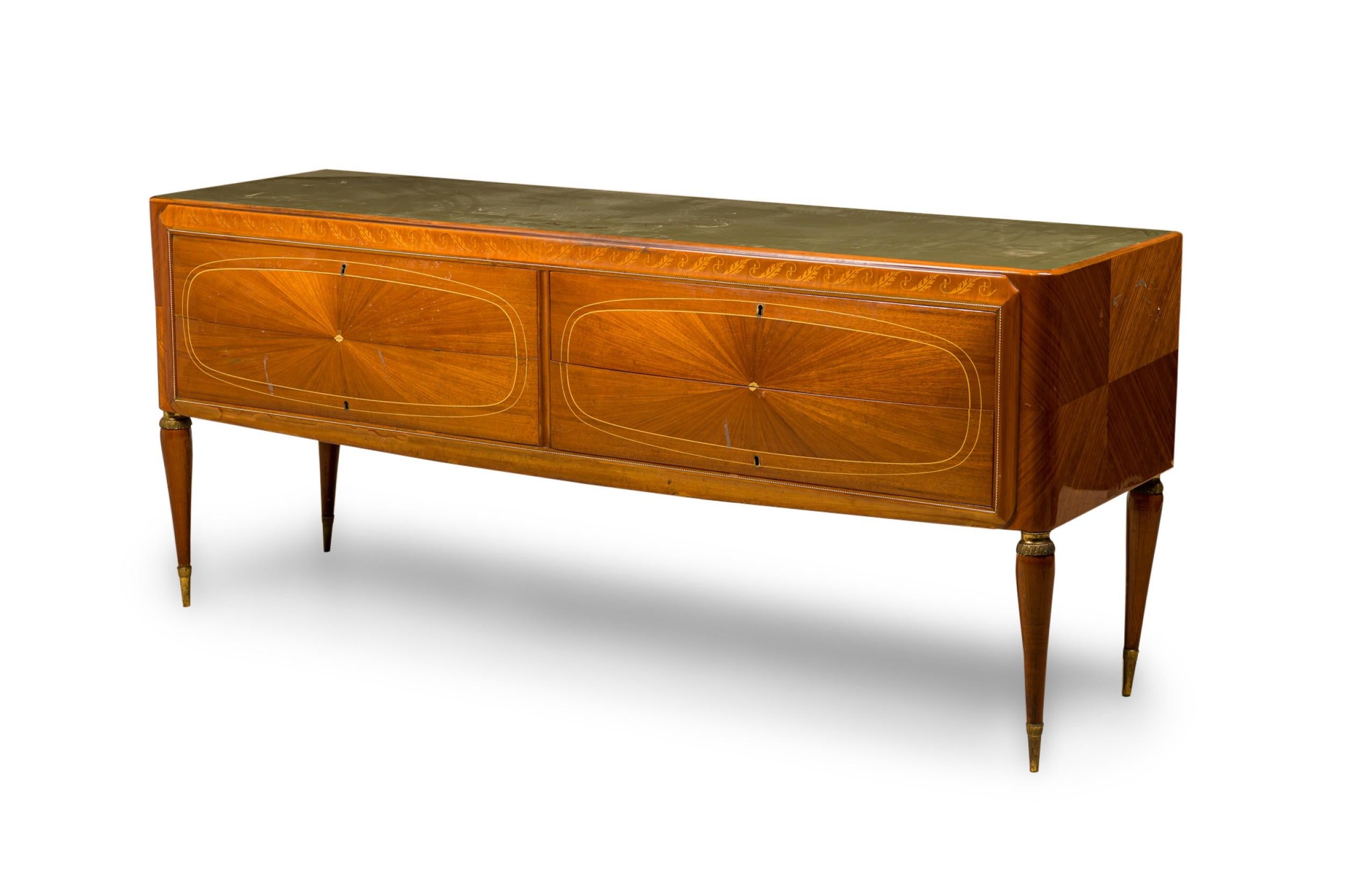 Italian Mid-Century Modern (1950s) mahogany and fruitwood sideboard / buffet with four drawers inside a fine twisted brass inlaid border, with oval inlaid designs, resting on four tapered legs. (VITTORIO DASSI)
 

 Significant wear to