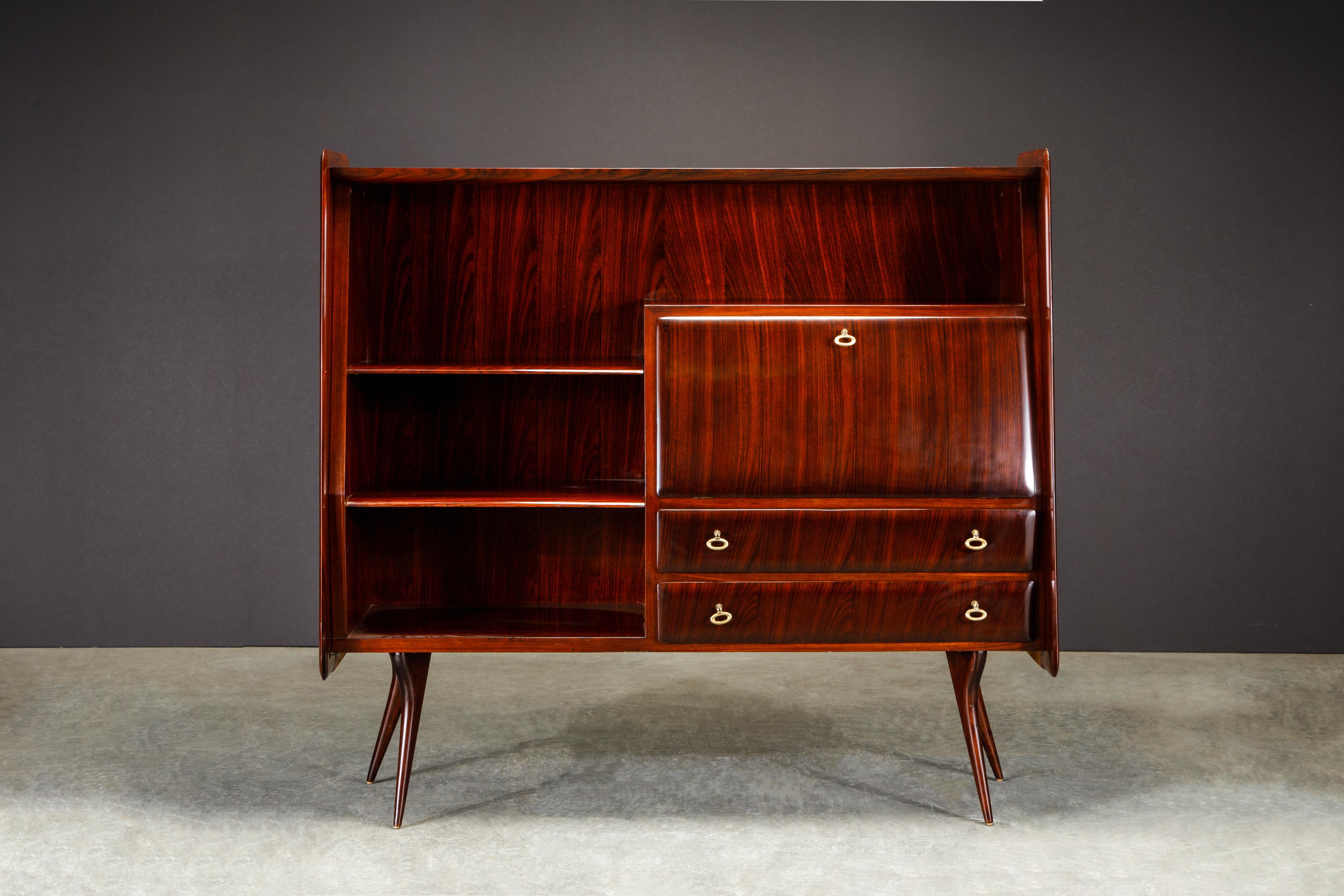 Add some Mid-Century Italian Modern elegance to your space with this fully restored Rosewood sideboard / liquor cabinet designed by Vittorio Dassi, originally completed in the 1950s and restored in 2021. 

The subtly tapered design was crafted