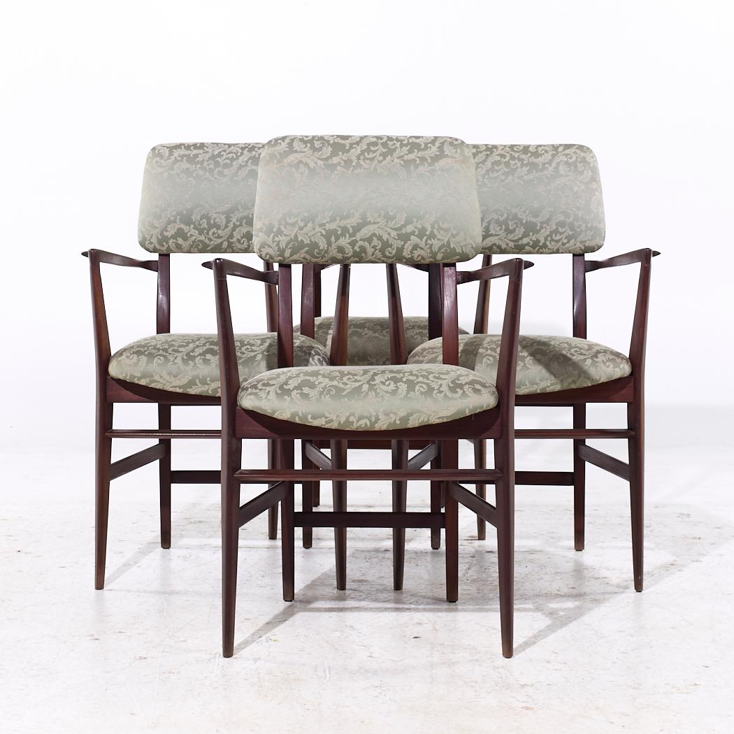 Vittorio Dassi Mid Century Italian Teak Dining Chairs - Set of 4

Each chair measures: 22.75 wide x 23 deep x 35.75 inches high, with a seat height of 19 and arm height/chair clearance of 24 inches

We take our photos in a controlled lighting studio