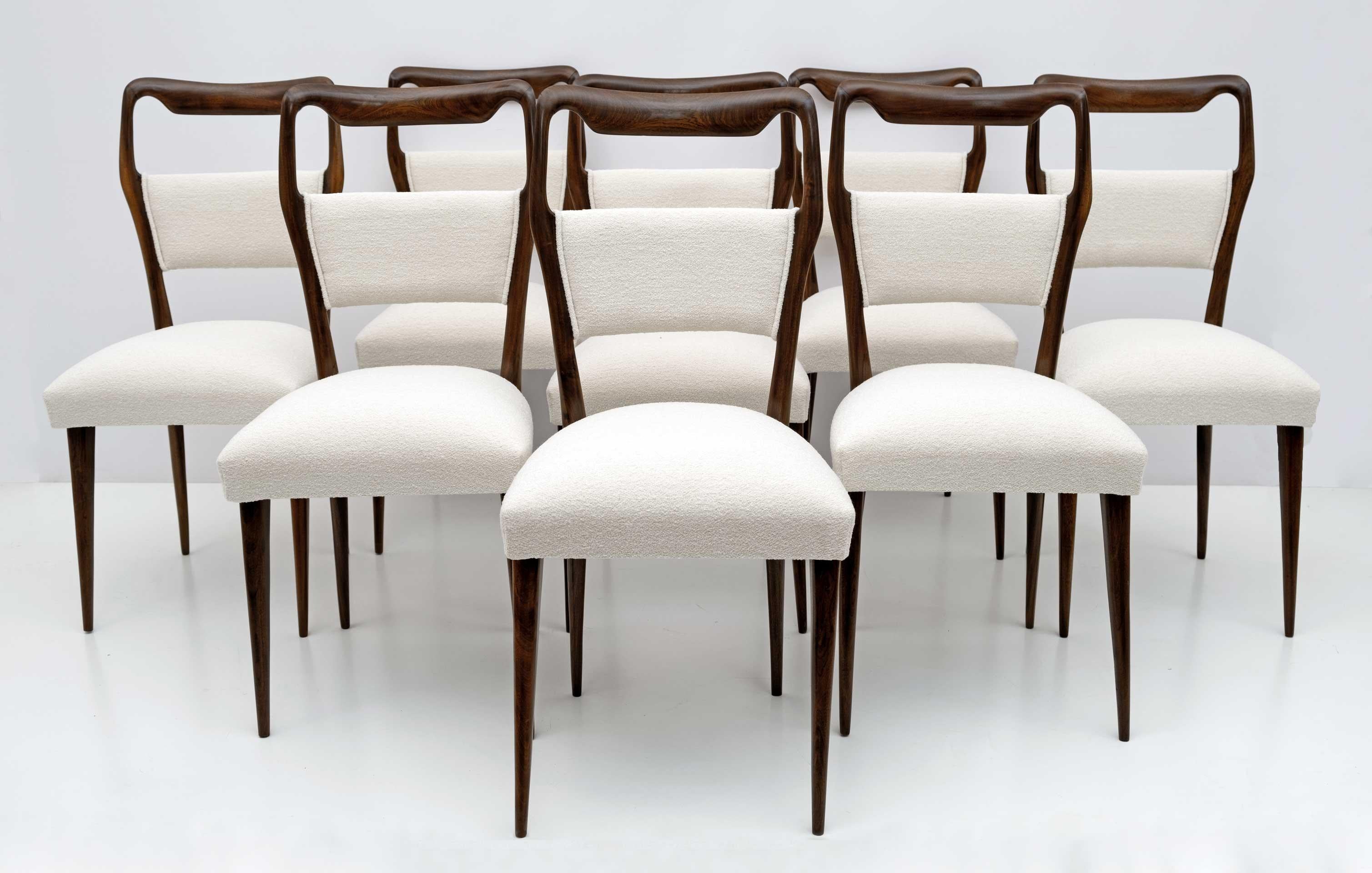 Gorgeous set of eight Italian Vittorio Dassi midcentury dining chairs recently upholstered in ivory Bouclè fabric, restored and polished with shellac.