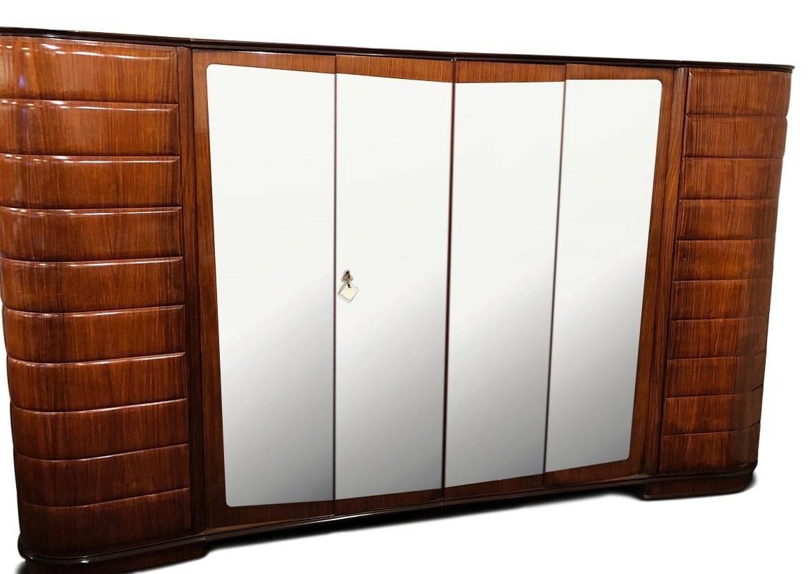 Art Deco custom armoire designed and made in Italy by Vittorio Dassi from their moderne mobil collection. Extremely rare! Purchased in France, restored and shipped back to the United States. Spectacular quality in both the outside wood, with