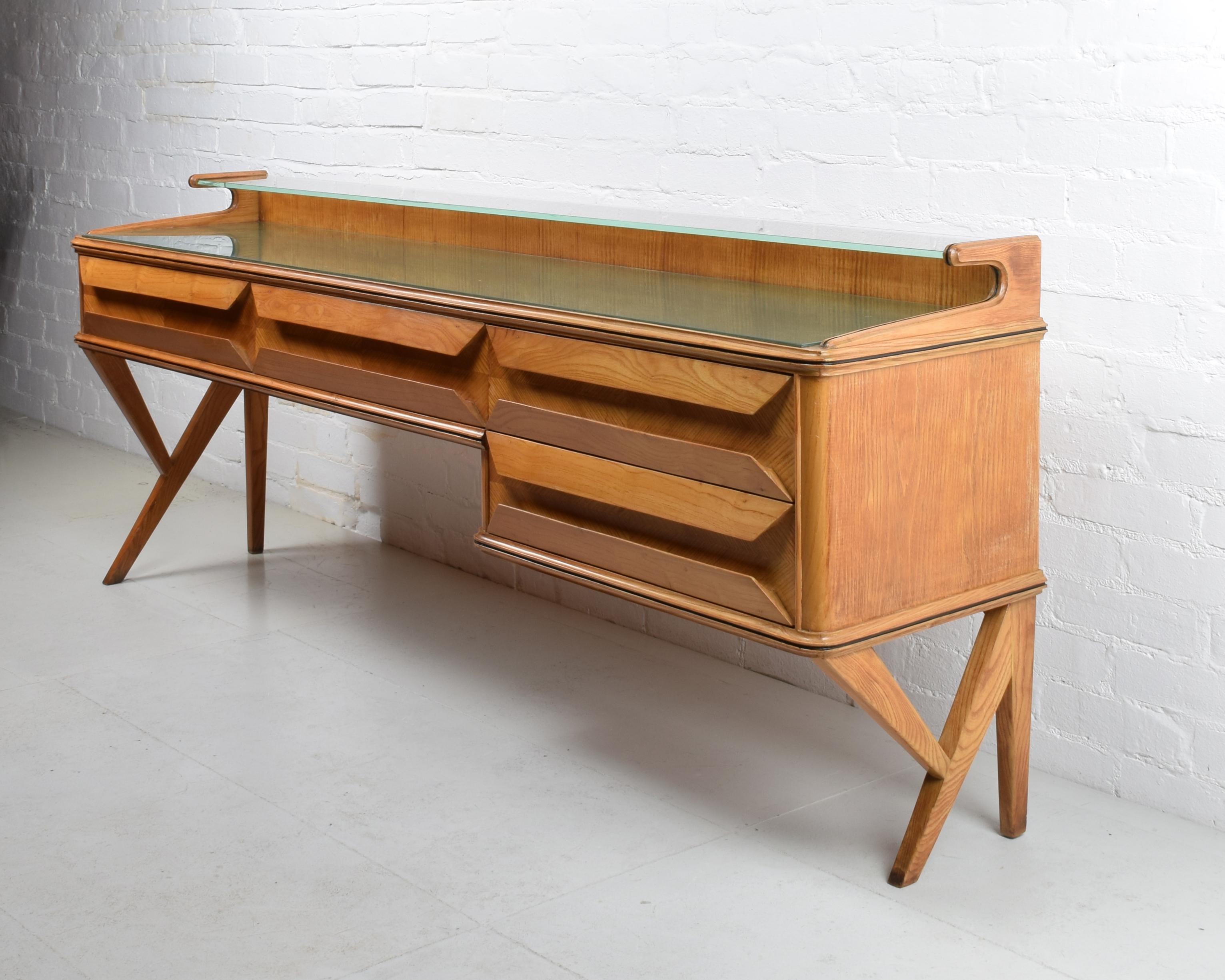 Vittorio Dassi, Italy (designer)

Sideboard
Produced at Dassi Mobili Moderni, Lissone, c. 1955
Wood, glass
Beautiful original condition. Some lifting to the backpainting of the glass.

Dimensions approx.:  W 193 cm, D 44 cm, H 78.5 cm (68 cm to main