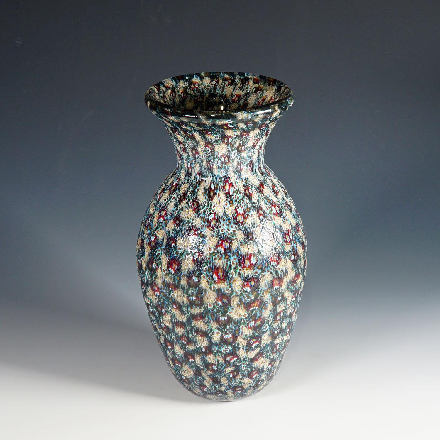A Mid-Century Modern murrine art glass vase designed and executed by Vittorio Ferro Murano, Italy circa 2000s. This authentic vintage Italian art glass vase features small murrines in multicoloured opaque glass.

Measures: height: 12.6