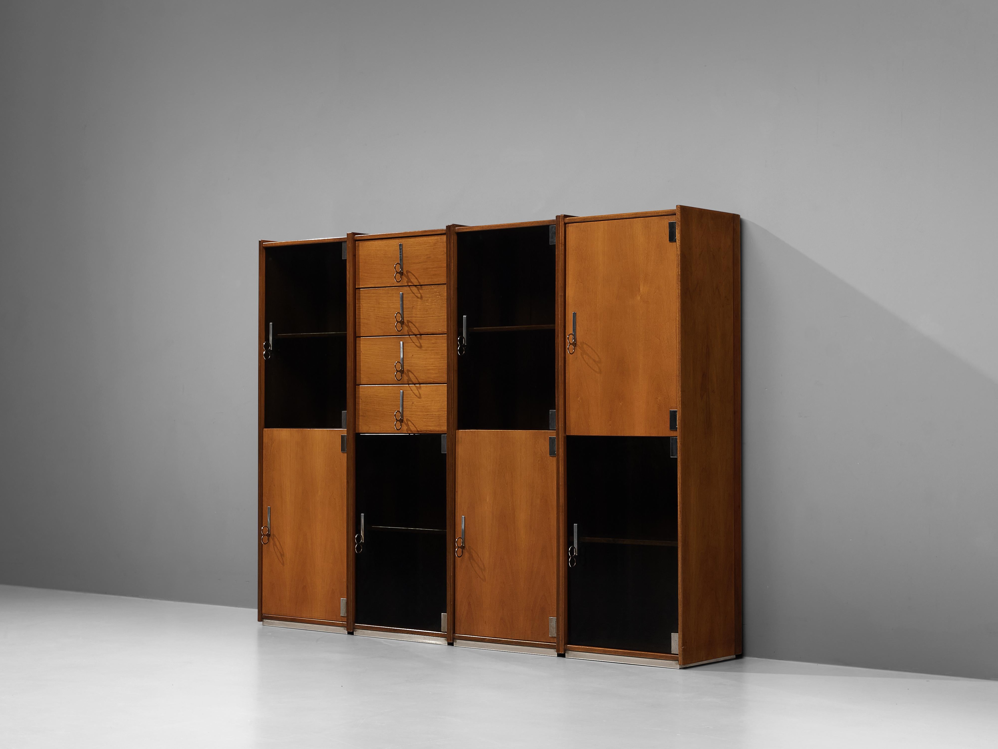 Vittorio Introini for Saporiti, free-standing cabinets, walnut, glass, metal, Italy, 1960s

This design by Vittorio Introini allows you to adjust the arrangement of the four modules to your own liking. They can be places against a wall or be used