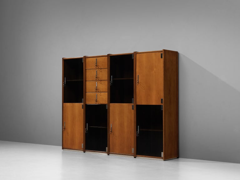 Vittorio Introini for Saporiti, free-standing cabinets, walnut, glass, metal, Italy, 1960s

This design by Vittorio Introini allows you to adjust the arrangement of the four modules to your own liking. They can be places against a wall or be used