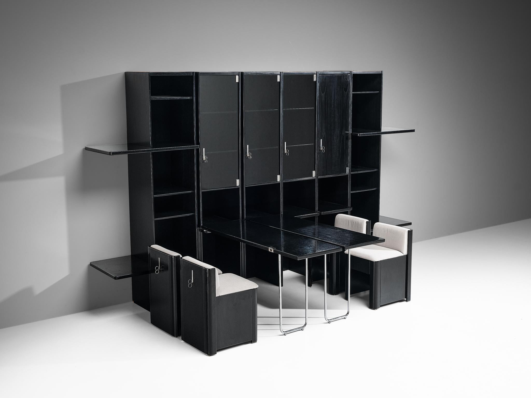 Vittorio Introini for Saporiti, multifunctional wall unit, black lacquered ash, chrome and white fabric, Italy, 1980s. 

Rare multifunctional wall unit designed by the Italian designer Vittorio Introini. Its most outstanding feature is the option to