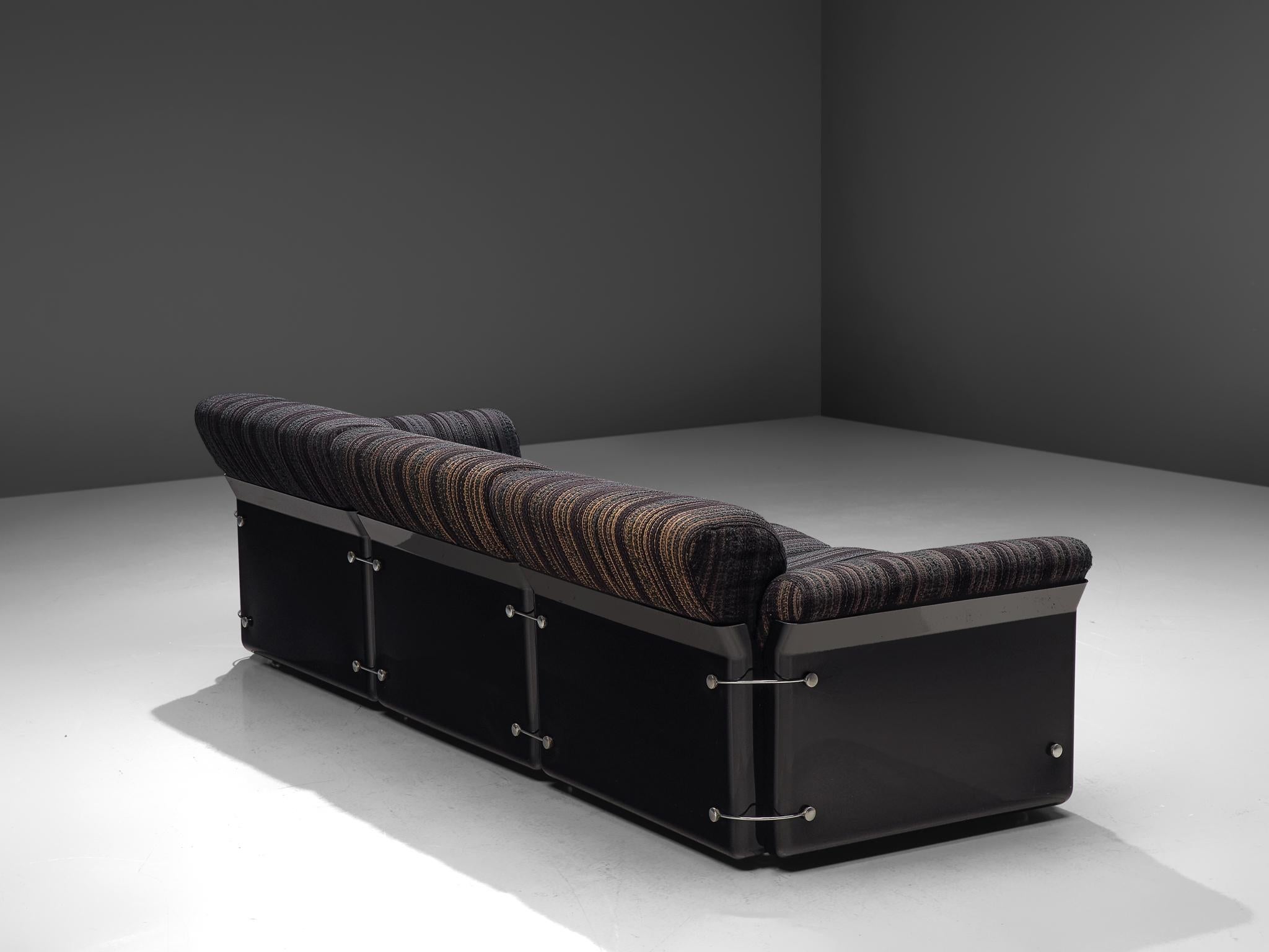 Vittorio Introini for Saporiti, three-seat sofa, fabric and chrome, Italy, 1969.

Bulky and sturdy 'Larissa' sofa designed by Vittorio Introini and produced by Saporiti in acrylic and dark blue/black striped upholstery. The pieces features a black