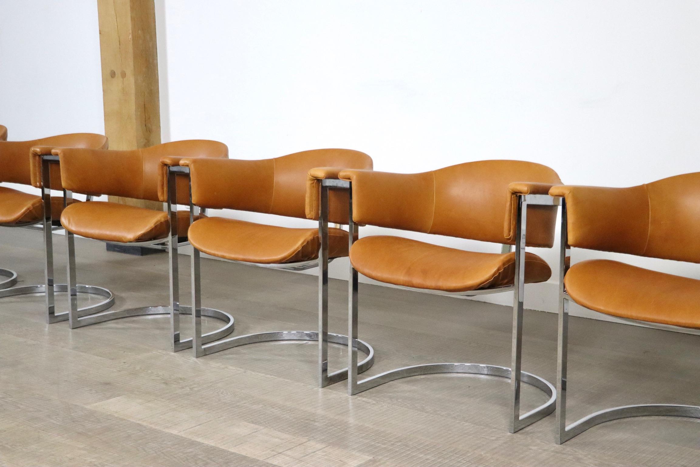 Amazing set of 6 cantilevered dining chairs in chromed steel and cognac leather by Vittorio Introini for Mario Sabot, Italy, 1970s. 
This incredible set is aside its outstanding design very comfortable. The cognac leather seating and backrests