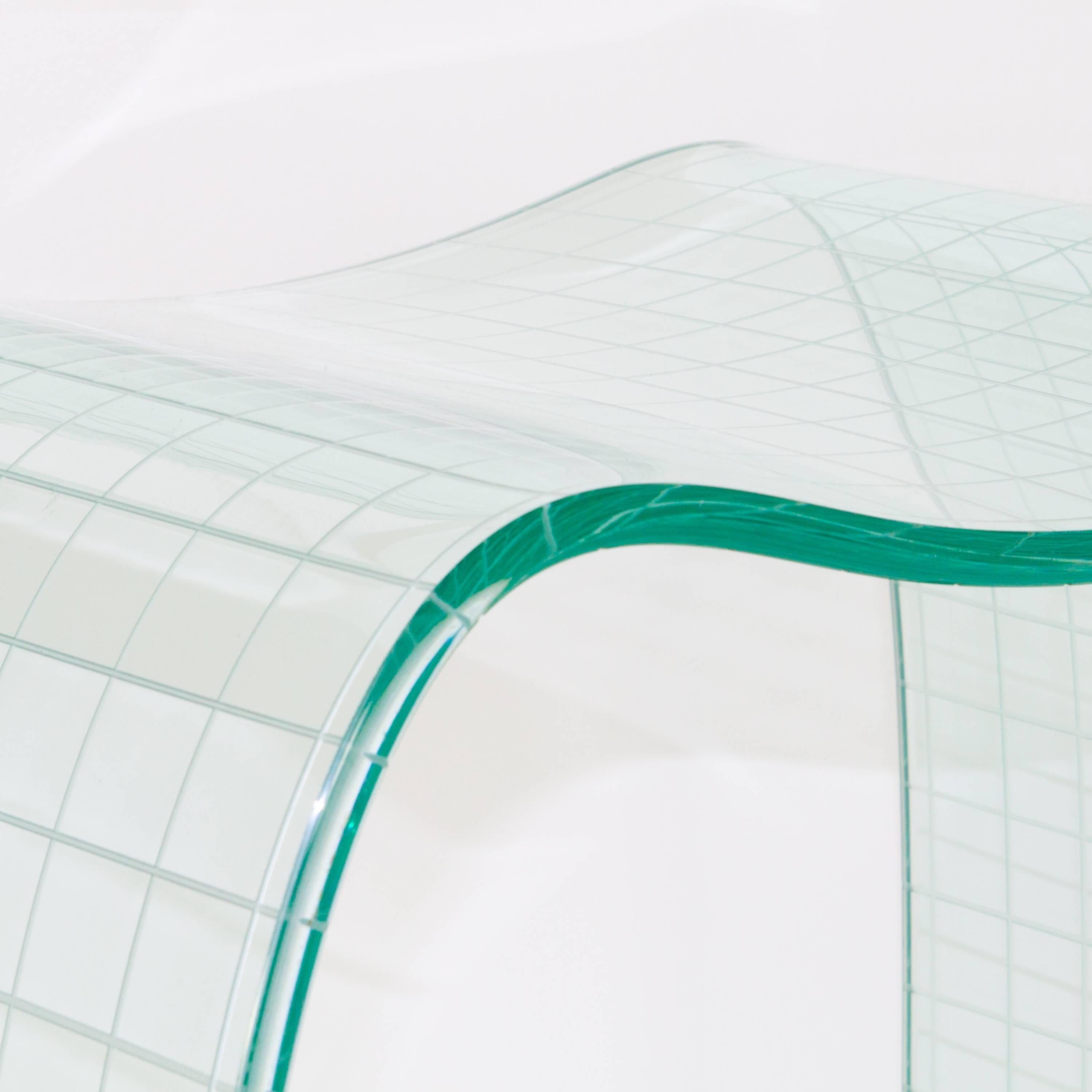 Onda Incisa glass stool by Vittorio Livi for Fiam, featuring expertly engineered glass curvature with an incised structural grid.