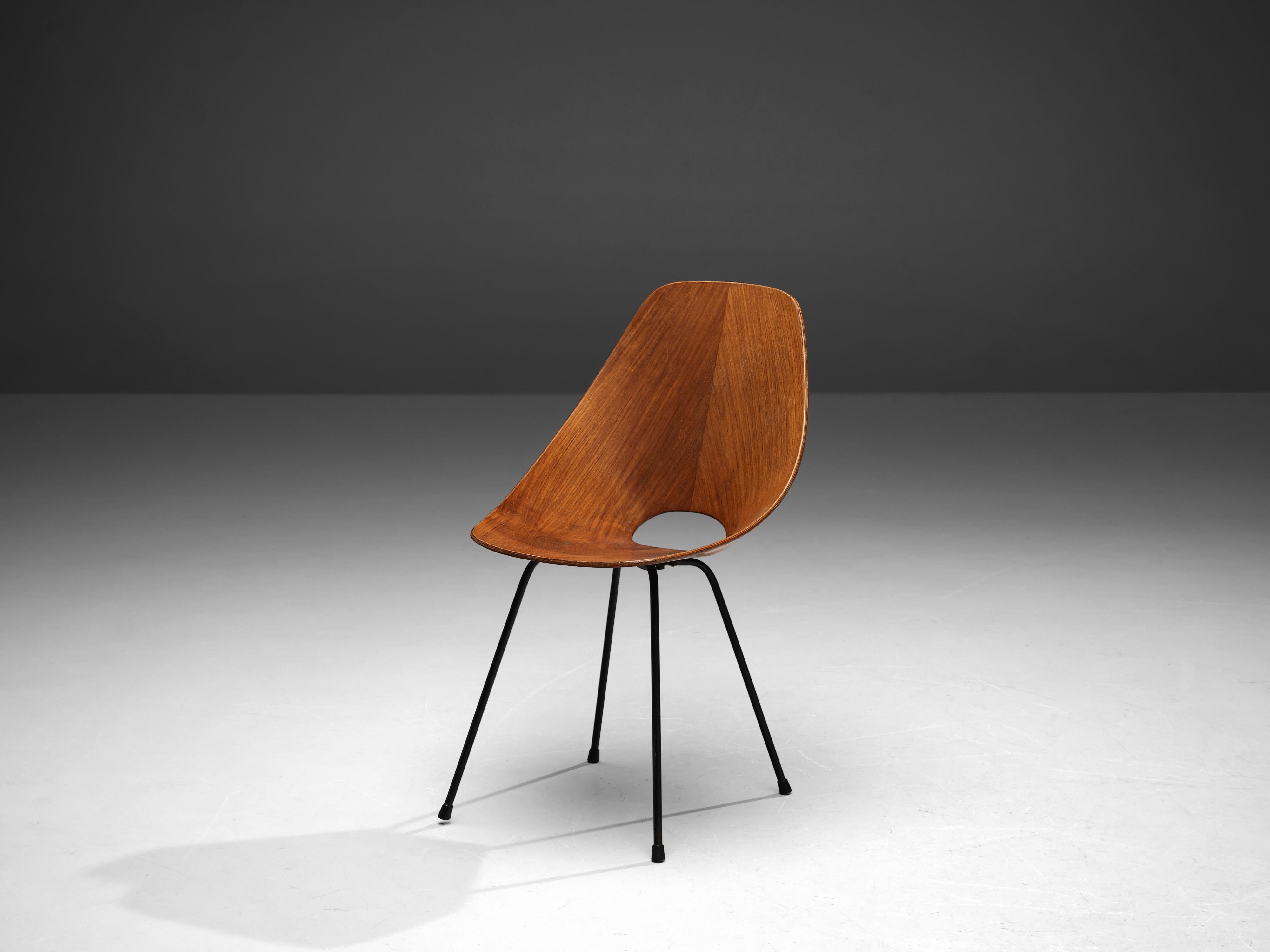 Vittorio Nobili for Tagliabue, dining chair 'Medea', teak and mahogany, Italy, 1955. 

This 'Medea' chair is designed by the Italian designer Vittorio Nobili. The plywood chair is veneered in carefully chosen mahogany, which gives it a warm