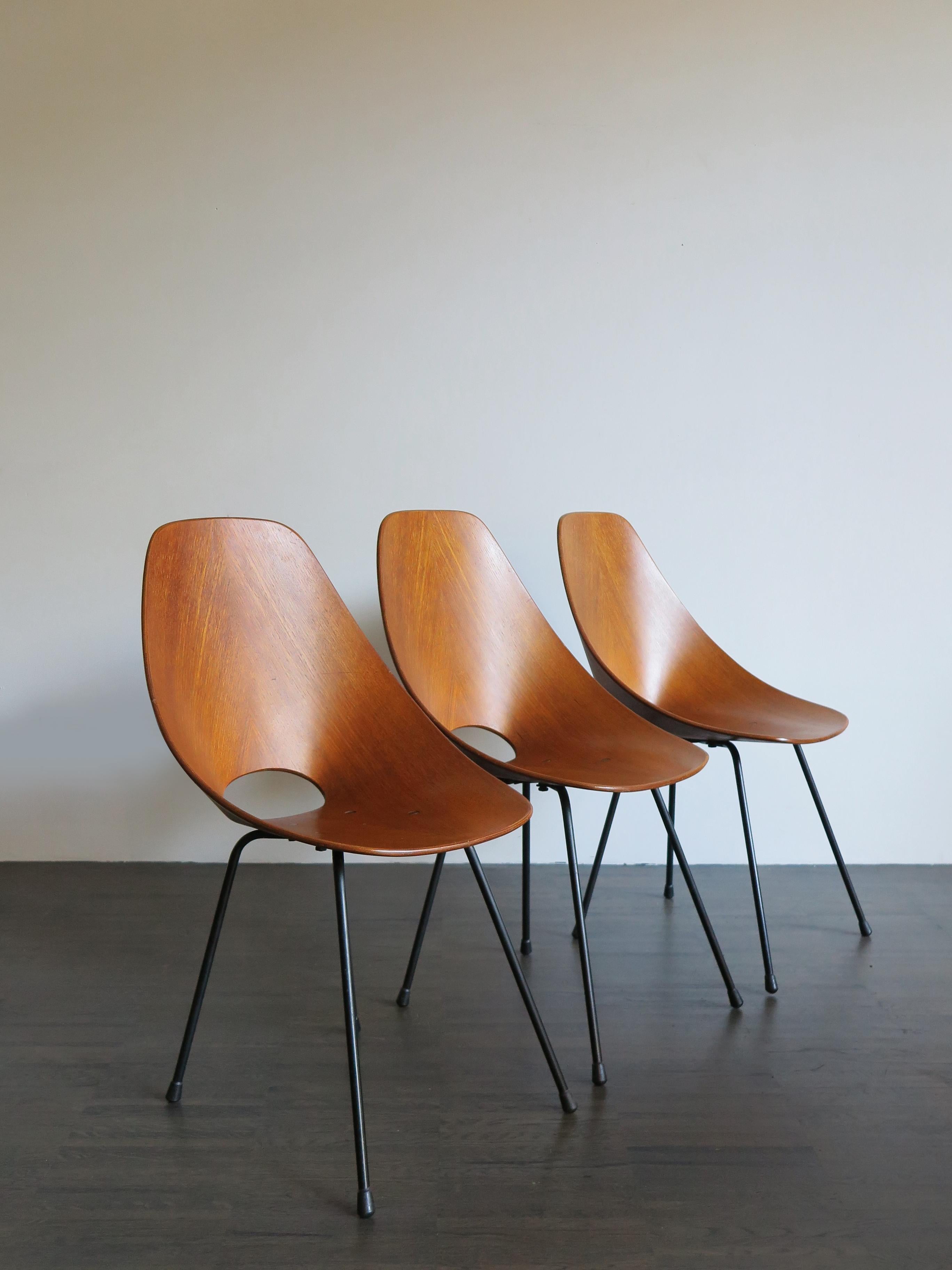 Italian midcentury set of three dining chairs model Medea designed by Vittorio Nobili and produced by Fratelli Tagliabue, veneered plywood, lacquered metal, this chair won the prestigious price “Compasso d’Oro in 1956.

Bibliography: G. Gramigna,