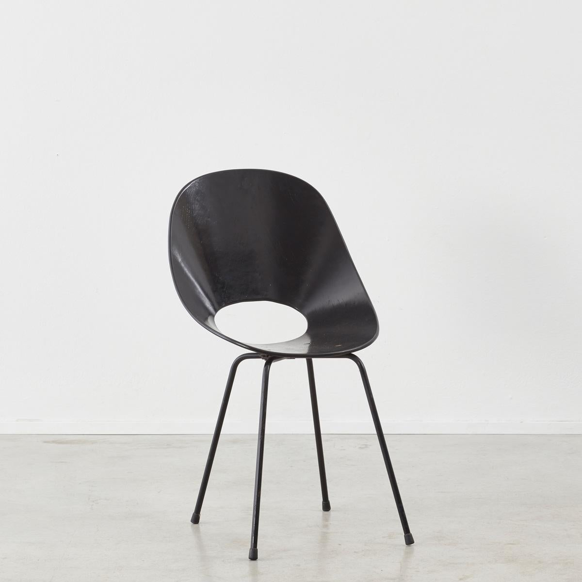 A perfect representation of the organic modern style, the ‘Medea’ chairs were designed by Vittorio Nobili for Fratelli Tagliabue in 1955. The teak wood seats are supported by black enamelled steel legs, accented with brass hardware. The natural