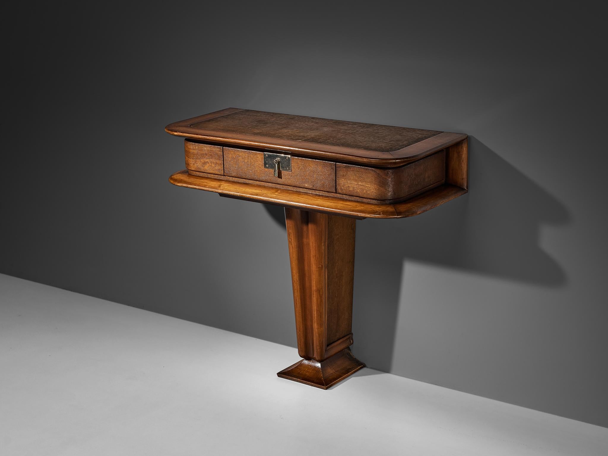 Vittorio Valabrega, console with drawer, walnut, leather, steel, Italy, 1940s

This console by the Italian designer Vittorio Valabrega is sculptural and elegant. Note the details in the base or the fine lines that surround the drawer. A metal handle