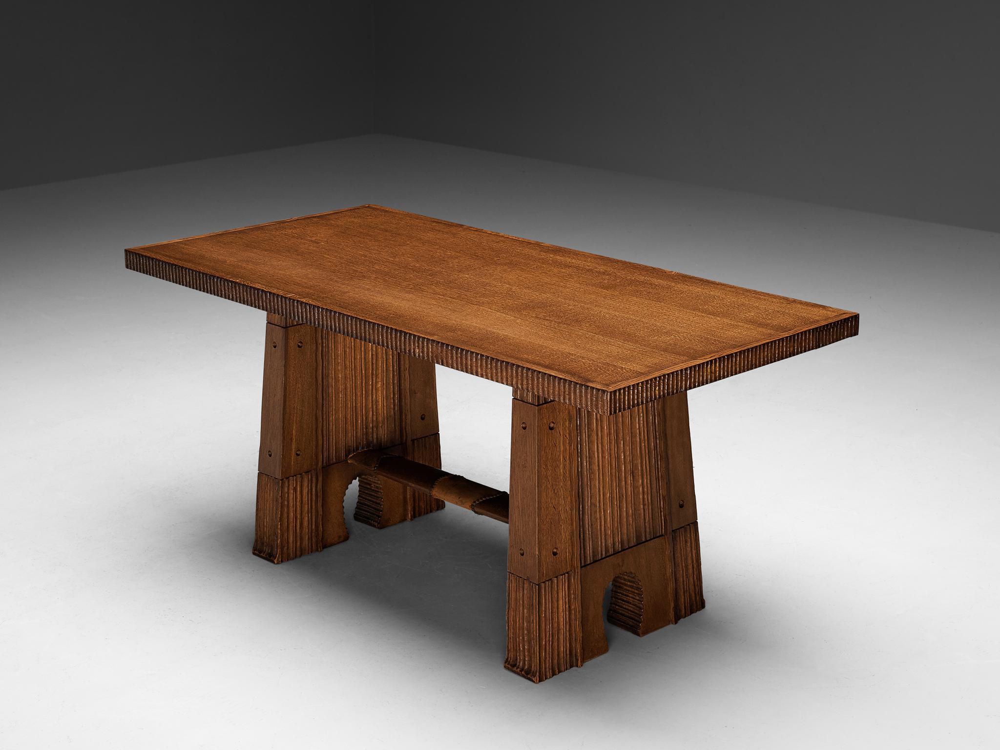 Vittorio Valabrega, dining table, oak, leather, iron, Italy, circa 1935 

Vittorio Valabrega once again proves his great eye for materialization and great craftsmanship this dining table is exemplary for. The table is architecturally built with