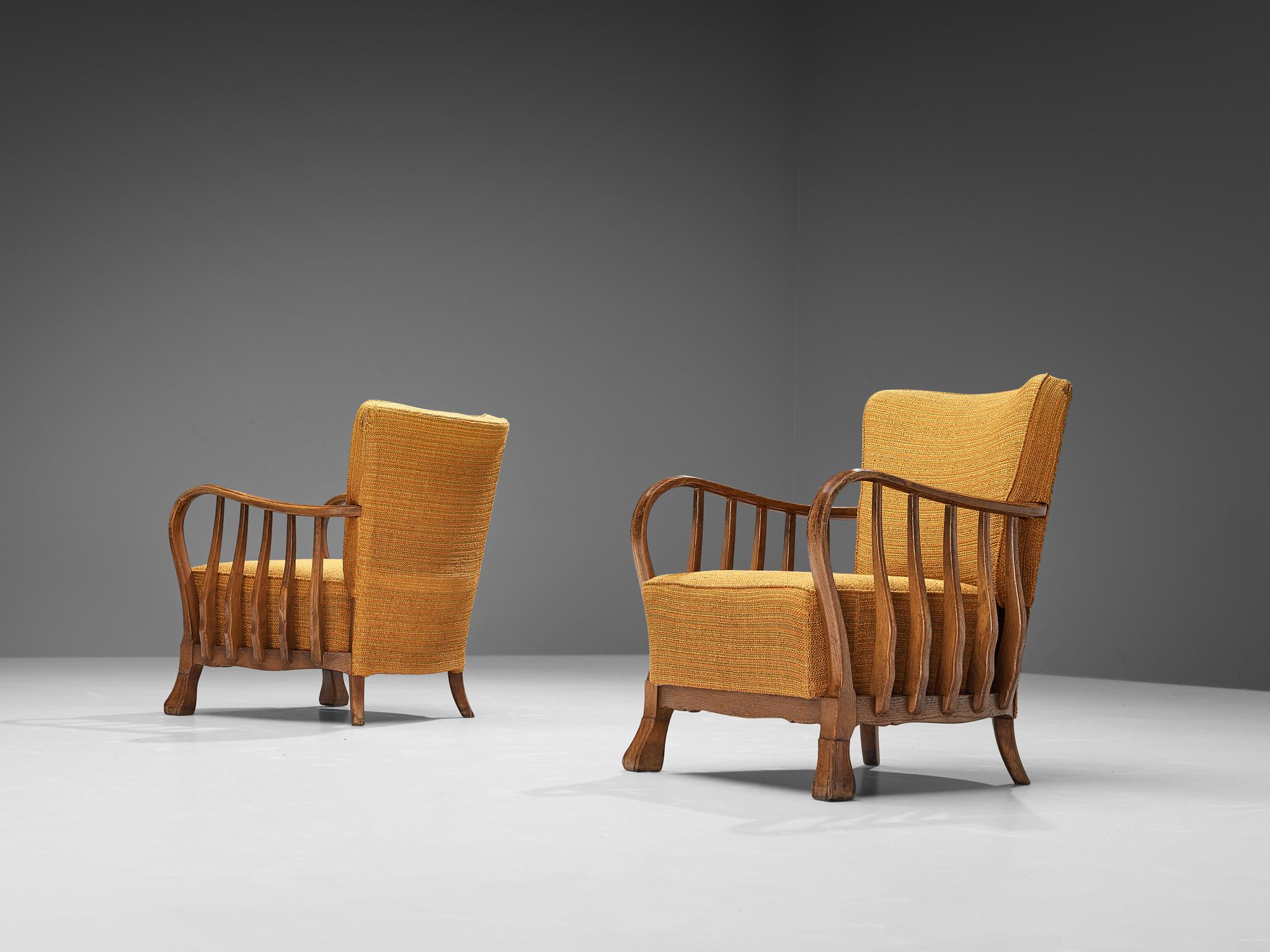 Vittorio Valabrega, pair of armchairs, oak, fabric, Italy, 1920s

This eccentric pair of lounge chairs embodies a splendid construction of subtle lines and curvaceous shapes. Remarkable detail and the signature for this design are the armrests that