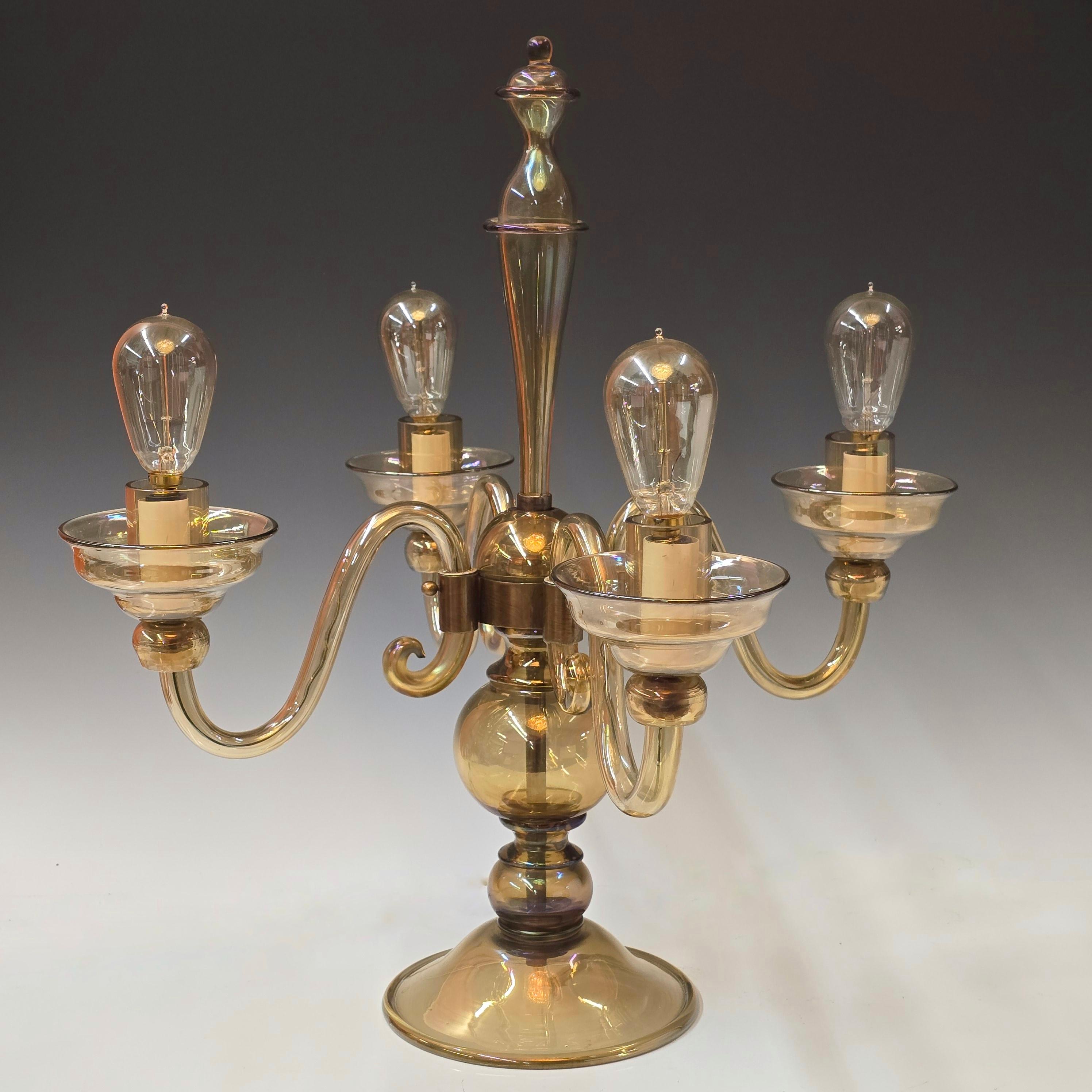 A super stylish rare documented candelabra style table lamp made  by Vittorio Zecchin out of brown iridato sofosiati glass.   Love the iridescent to the glass which is picked up at certain angles.  Lamp dates to 1927 and was designed by Zecchin and