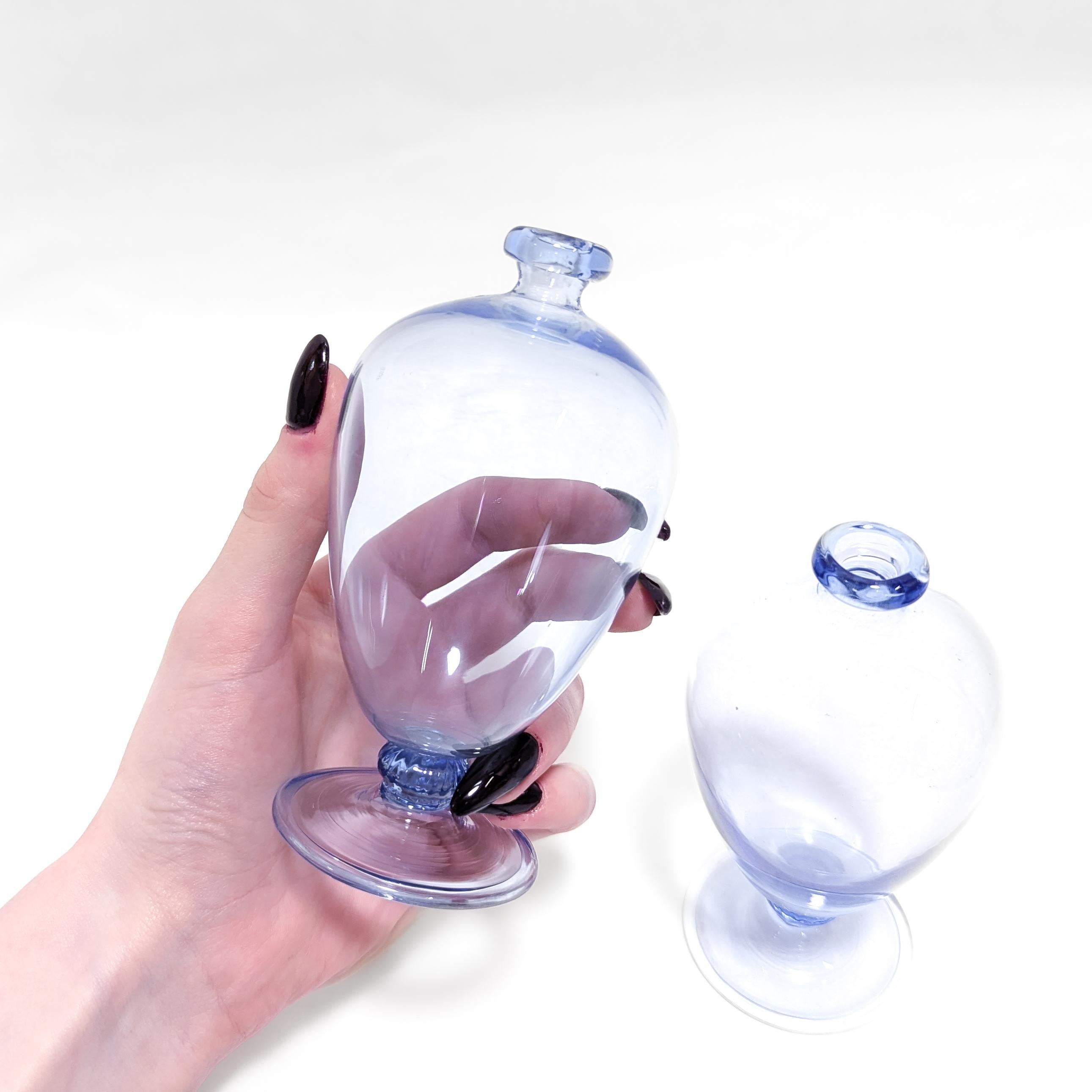 A fine pair of early Veronese Venetian glass vases.

By Vittorio Zecchin for MVM Cappellin.

In a clear light blue, thinly blown glass, blown. 

With a bulbous inverted teardrop body, a lightly fluted suppressed ball knop, and a trumpet form base
