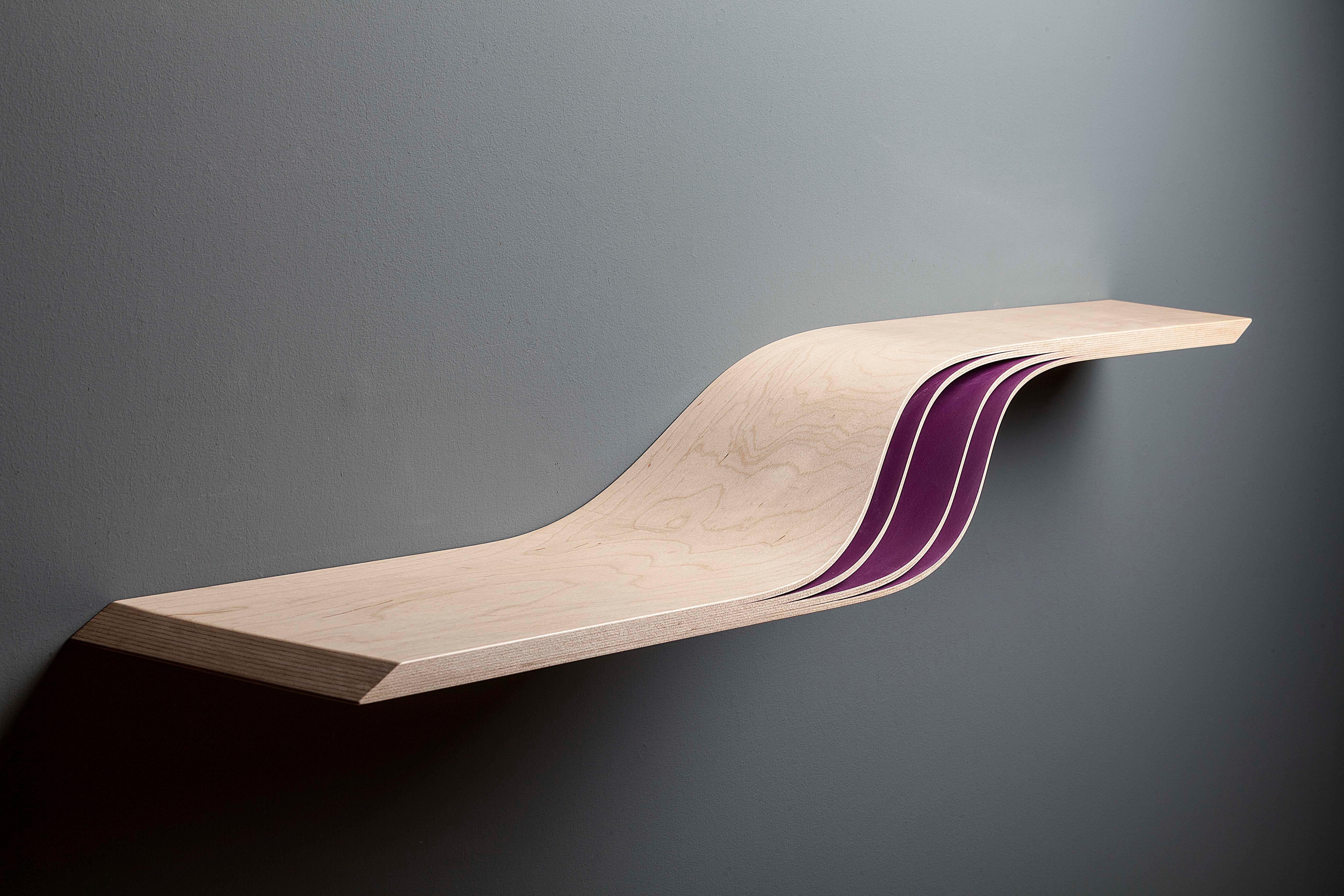 Vitulus shelf by David Tragen
Dimensions: W 110 x D 14 x H 20 cm
Materials: Maple, Magenta or Turquoise painted details
Length and paint can be customized.

The elegant balletic movement of a seal (vitulus in Latin), darting through the waves