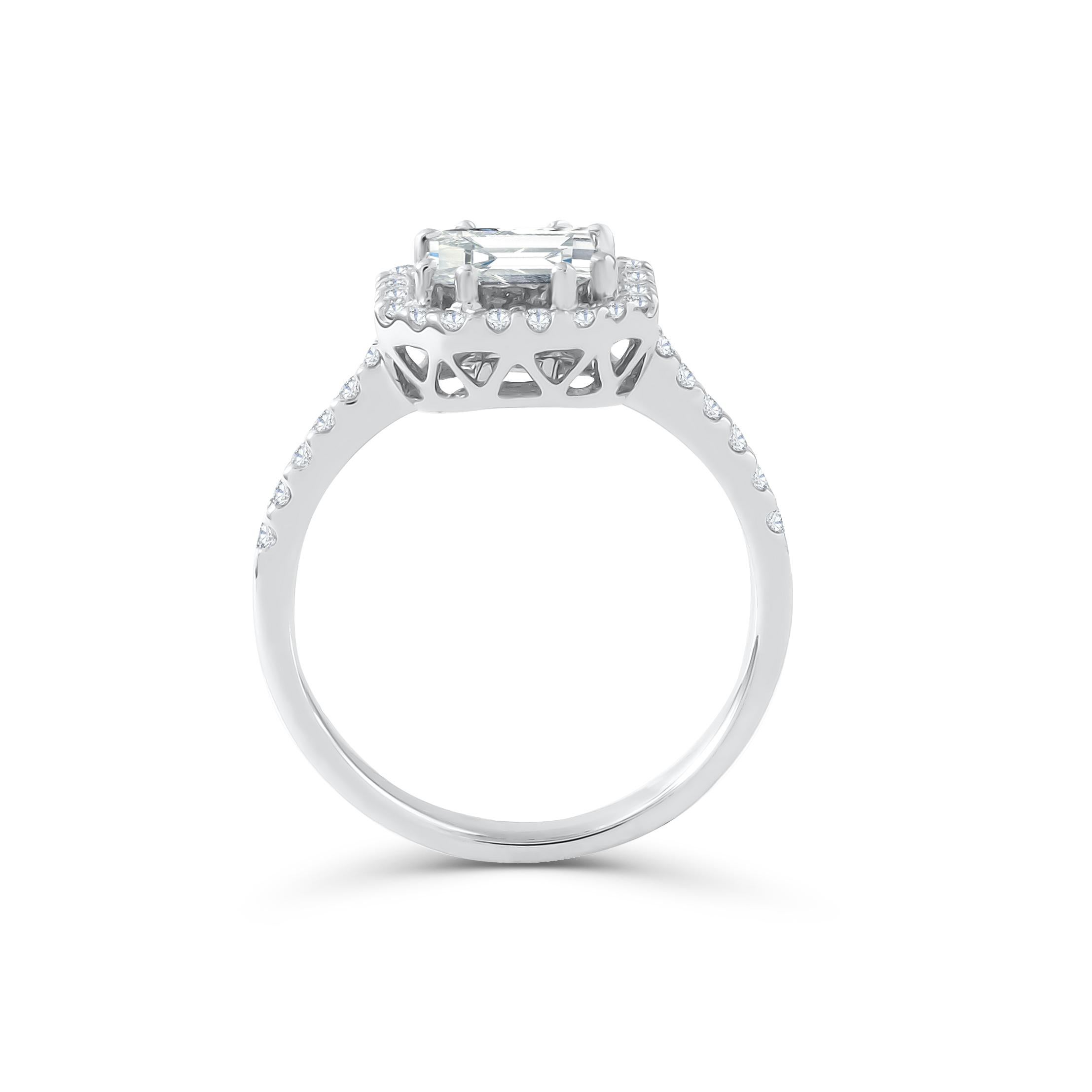 This diamond ring has a Emerald shape Illusion (Pie Cut) to create the look of a 2.50 carat single Emerald cut stone surrounded beautifully with brilliant round diamonds, Handcrafted in 18 kt white gold. This Ring will add a touch of sophistication