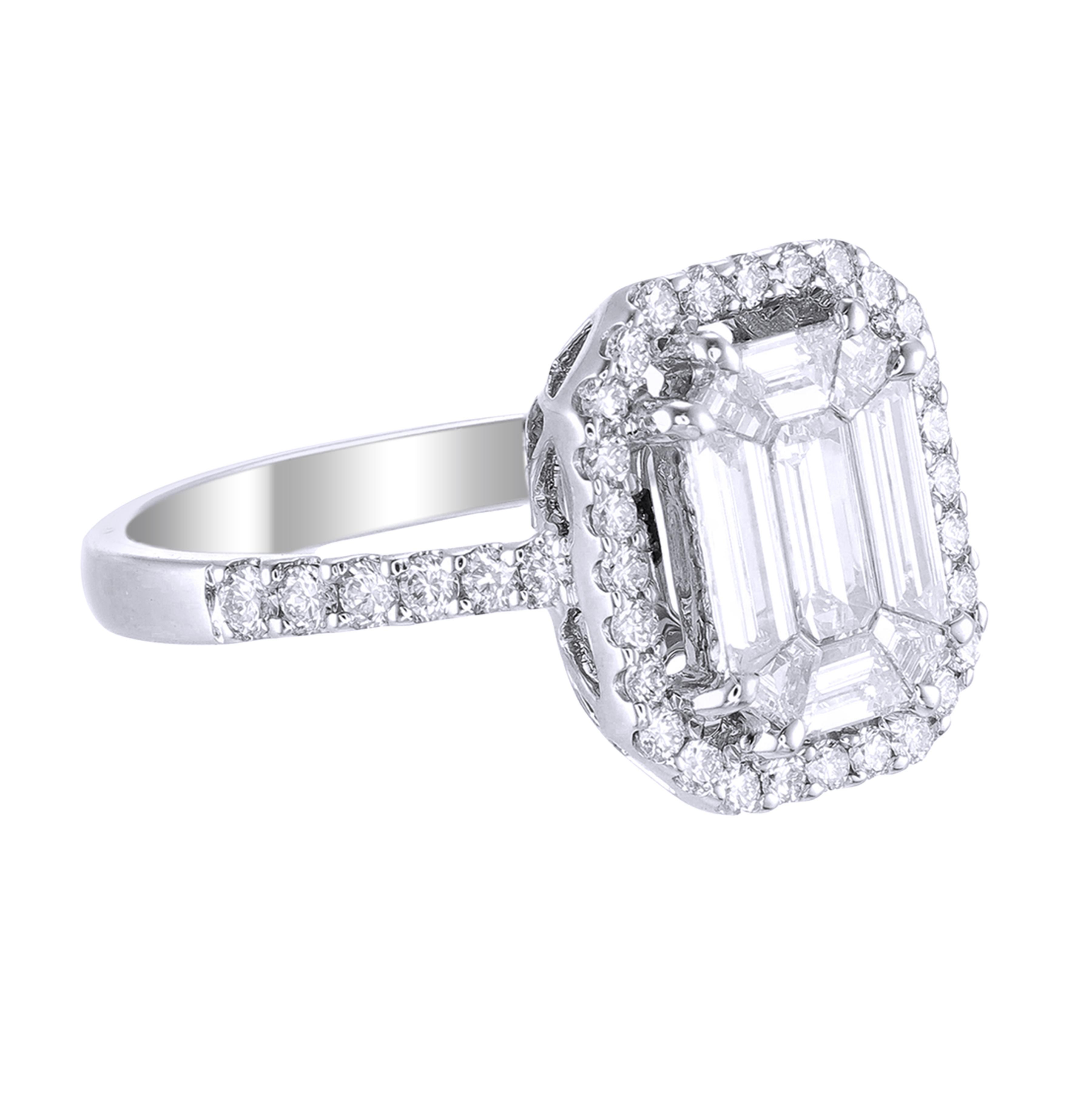 This diamond ring has a Emerald shape Illusion to create the look of a 2.50 to 3 carat single Emerald cut stone surrounded beautifully with brilliant round diamonds, Handcrafted in 18 kt white gold, the total diamond weight of this ring is 1.27