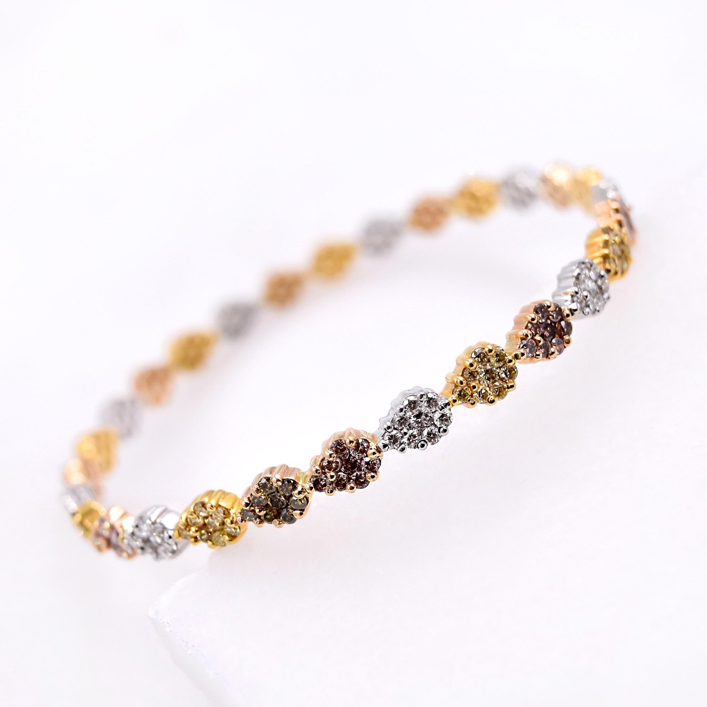 Vivaan Multicolored Diamond Bangle
- 5.89 Carats of Multicolored Round Diamonds
- Sections of 18 Karat White, Yellow, and Rose Gold
- Each Section holds 8 Diamonds in a Prong Setting
- Inside Diameter of the Bangle is 2.5 Inches
