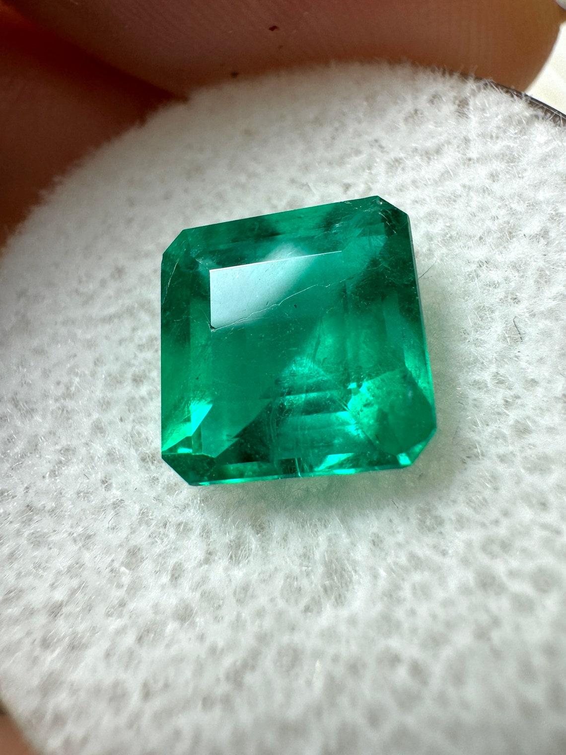 Stone: Emerald
Weight: 2.68-carats
Shape: Asscher Cut
Clarity: Transparent
Luster: Excellent
Color: Vivid Dark Green
Measurements: 8.60mm x 8.50mm x 5.53mm
Geographic Origin: Colombia
Treatment: Natural, Oiling

Comments: Due to their growth