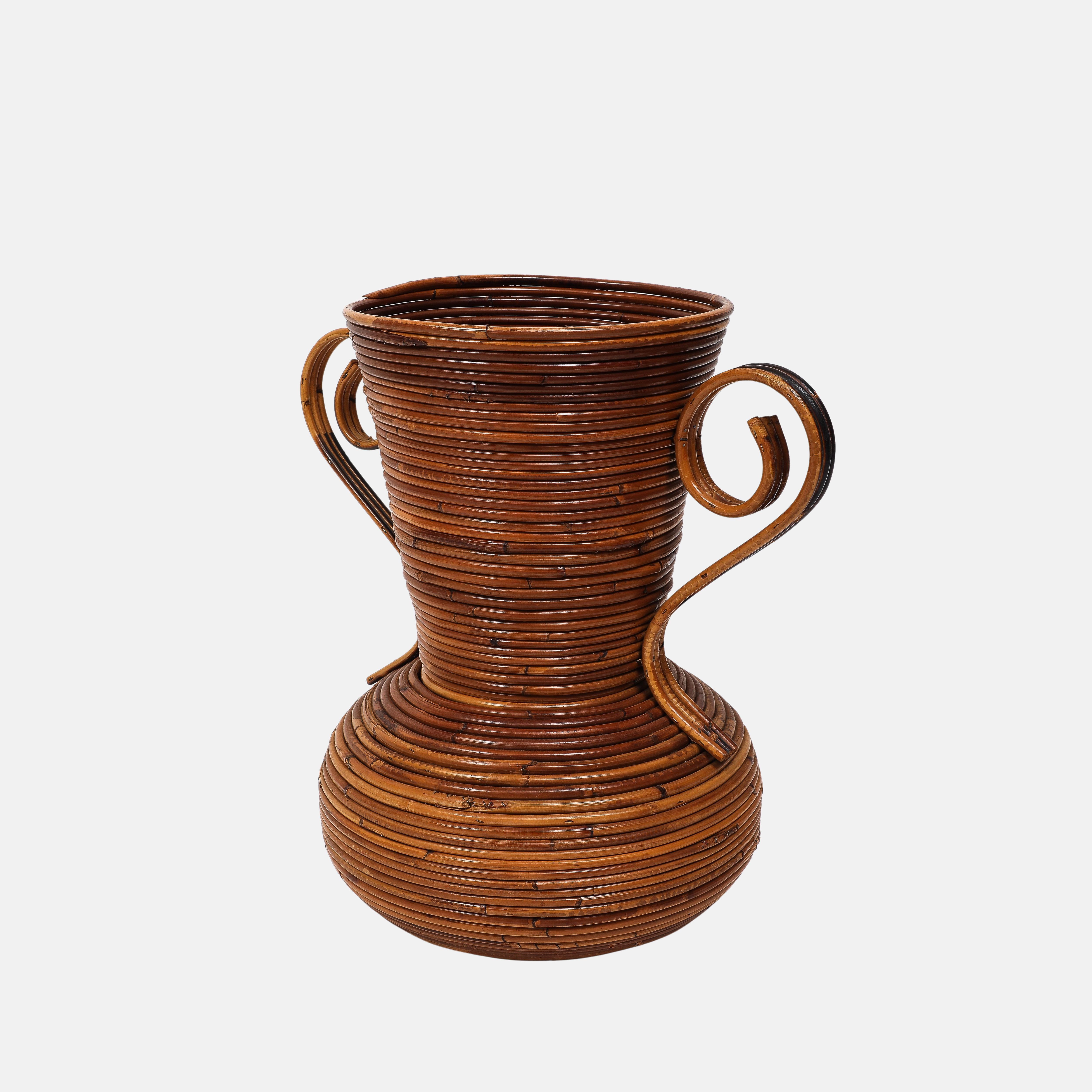 Vivai del Sud bamboo and rattan vase with two handles, Italy, 1970s.  This chic hand-woven vase has an earthy organic aesthetic and has an elegant, timeless appeal in any interior.

