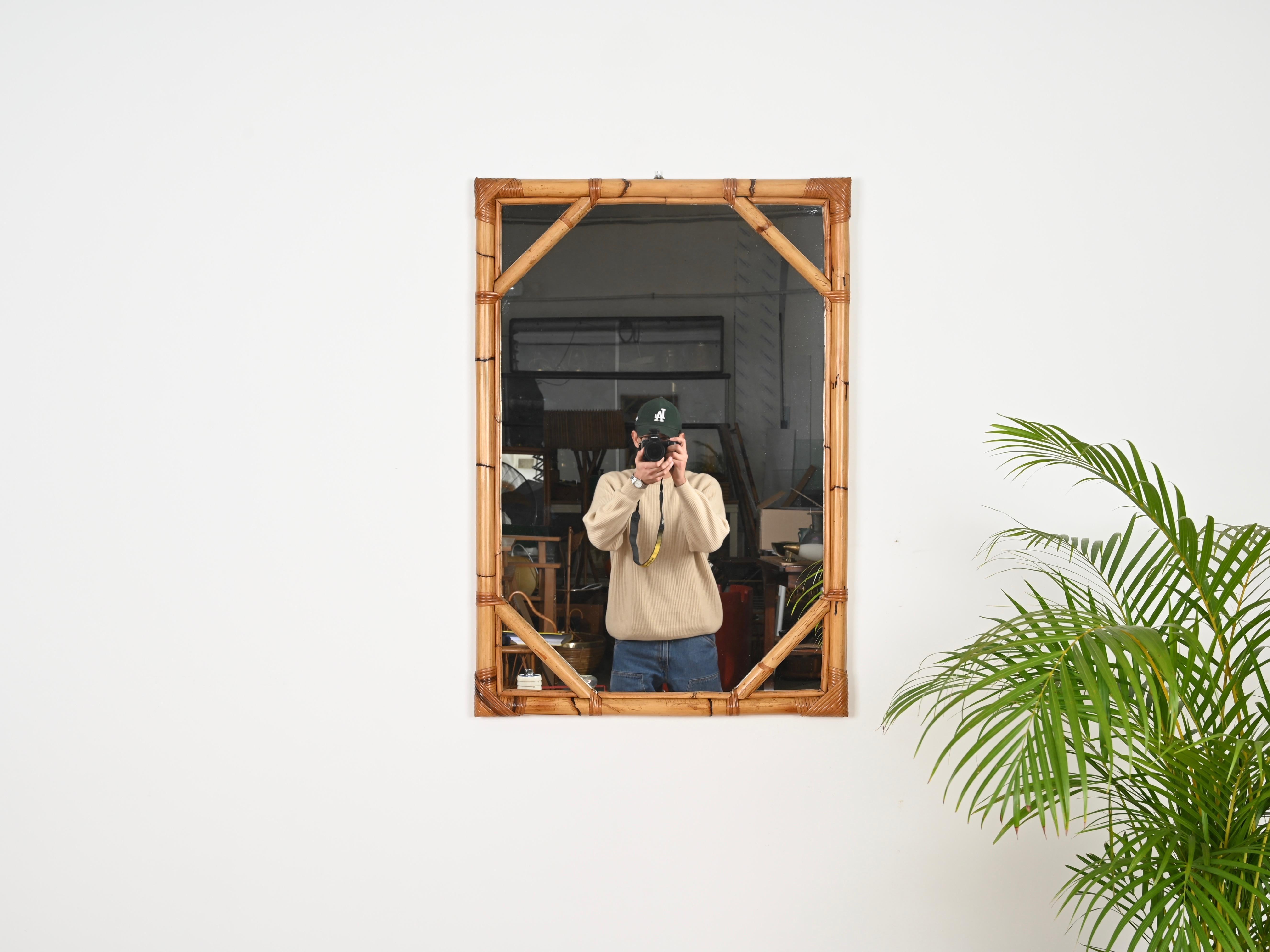 Marvelous large rectangular mirror in bamboo and hand-woven wicker. This stylish French Riviera style mirror was hand-made by Vivai del Sud in Italy during the 1960s.  

In fabulous conditions and with a stunning color. This large rectangular mirror