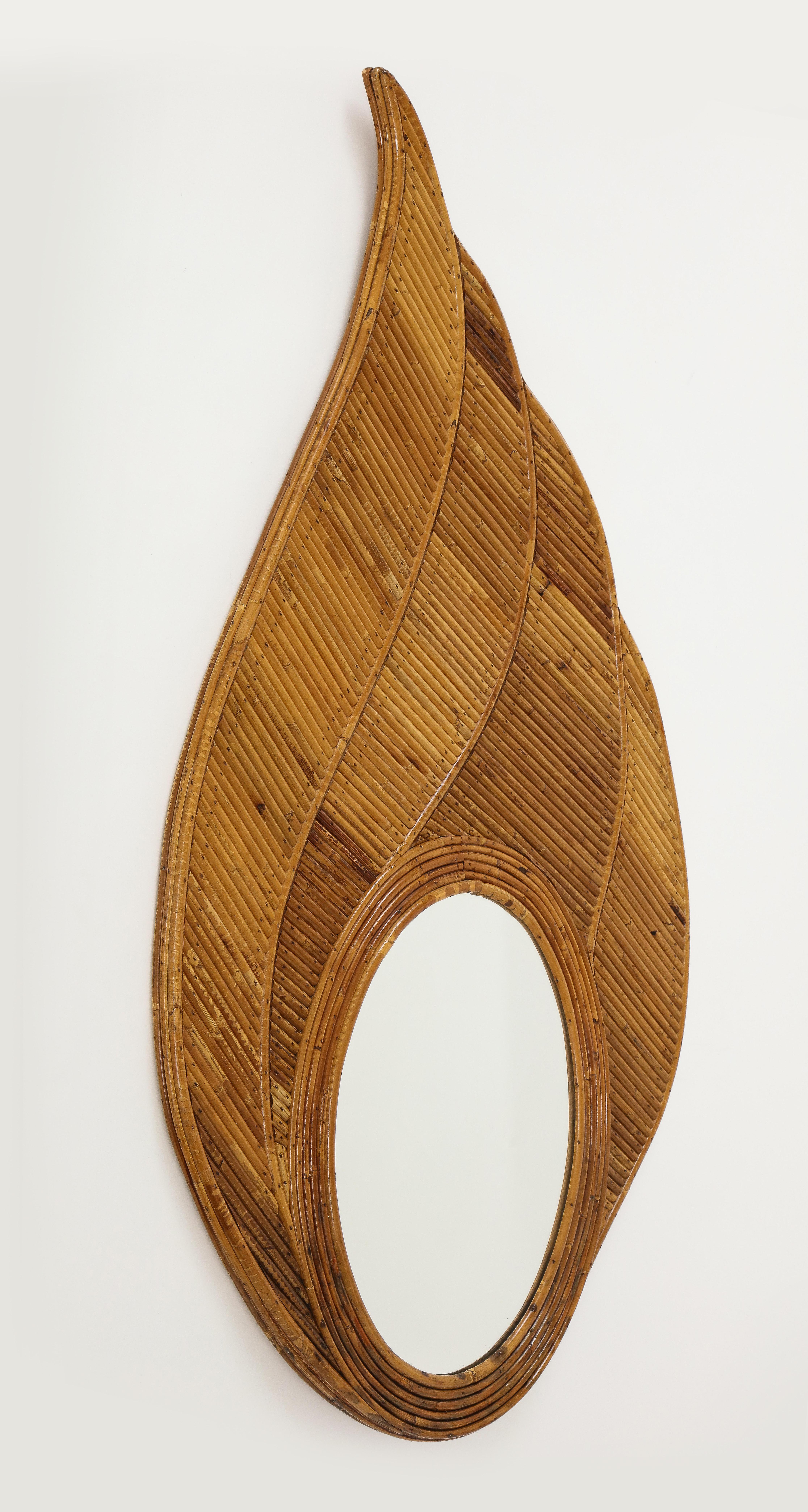 Vivai del Sud rare chic and organic bamboo mirror consisting of strips of pencil reed bamboo expertly handcrafted to create elegant leaf-shaped design. Fully restored with new lacquer finish.

Vivai del Sud was a Roman company established in 1950 as
