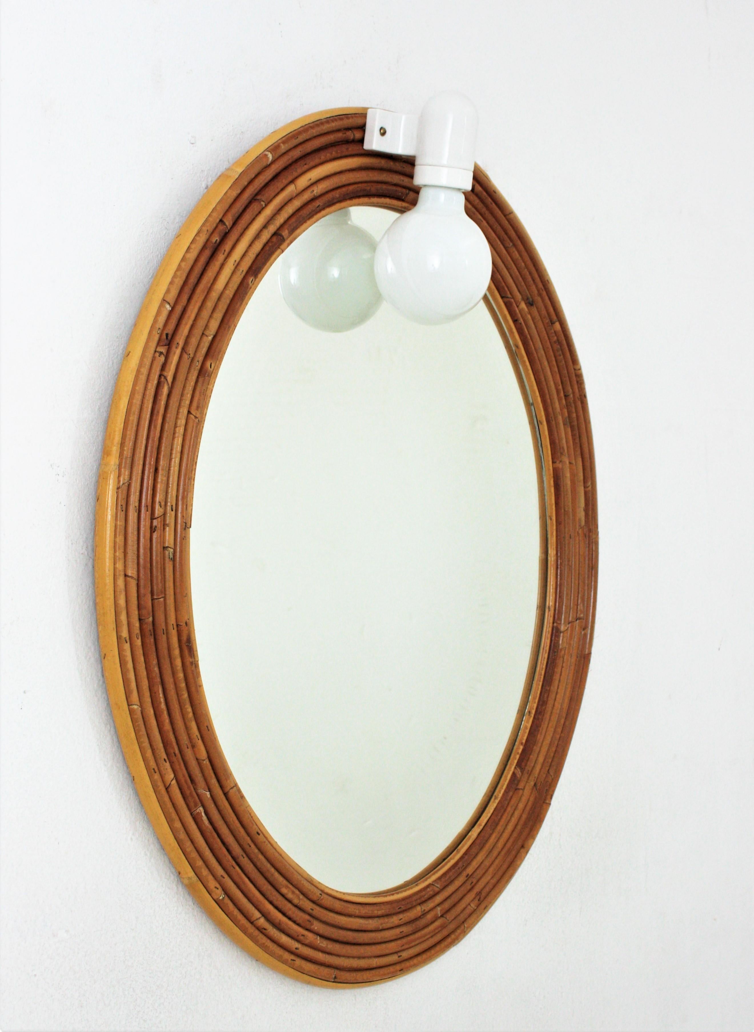 Mid-Century Modern Vivai del Sud Rattan Oval Mirror with Wall Light For Sale