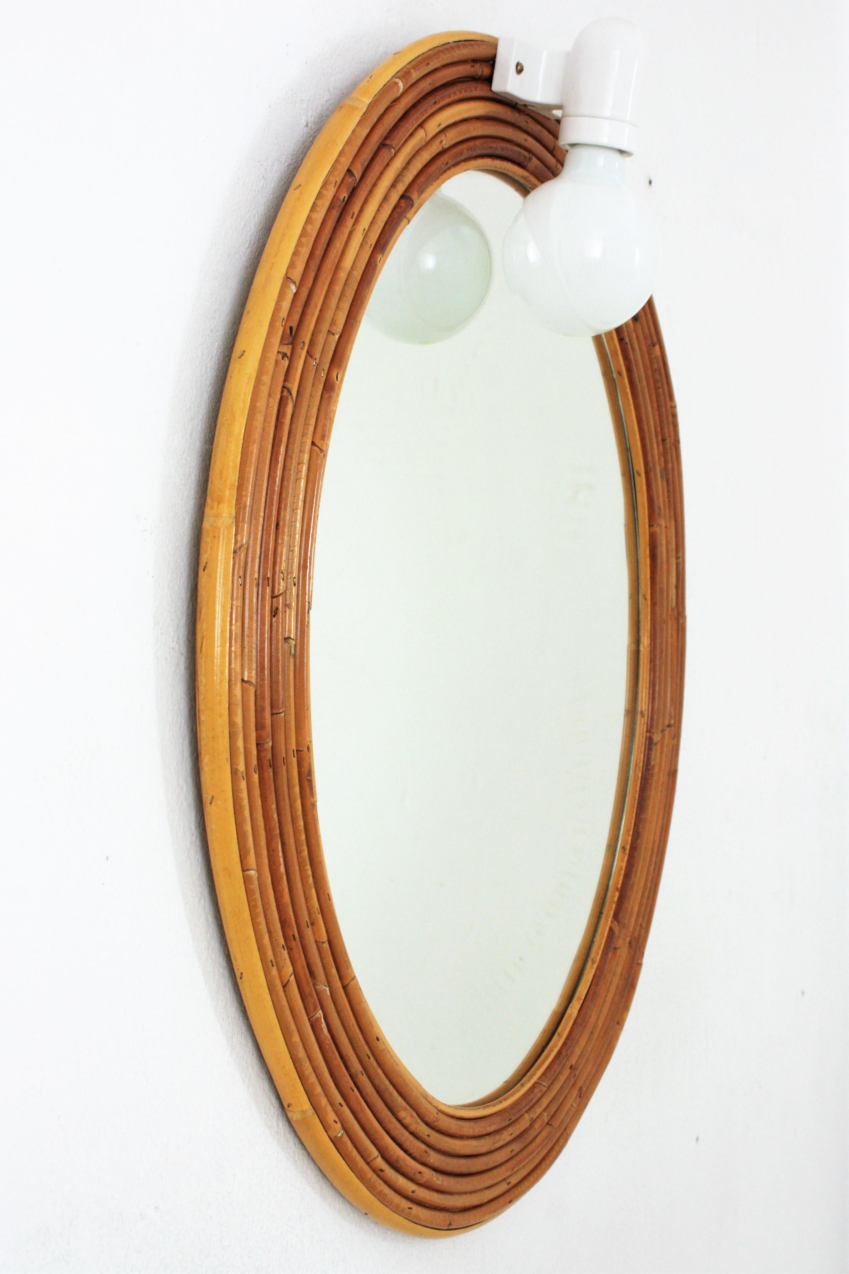 Italian Vivai del Sud Rattan Oval Mirror with Wall Light For Sale