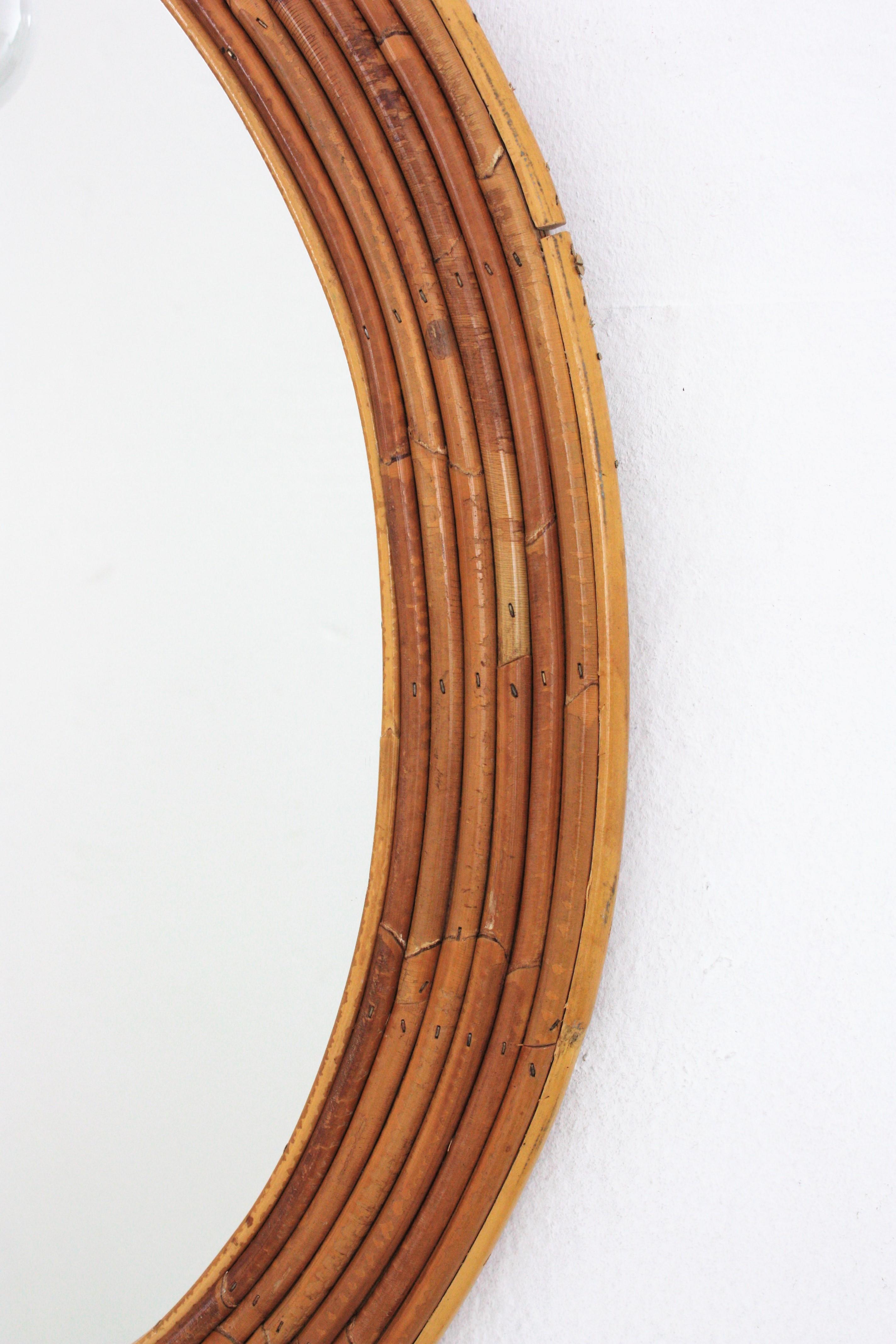 20th Century Vivai del Sud Rattan Oval Mirror with Wall Light For Sale