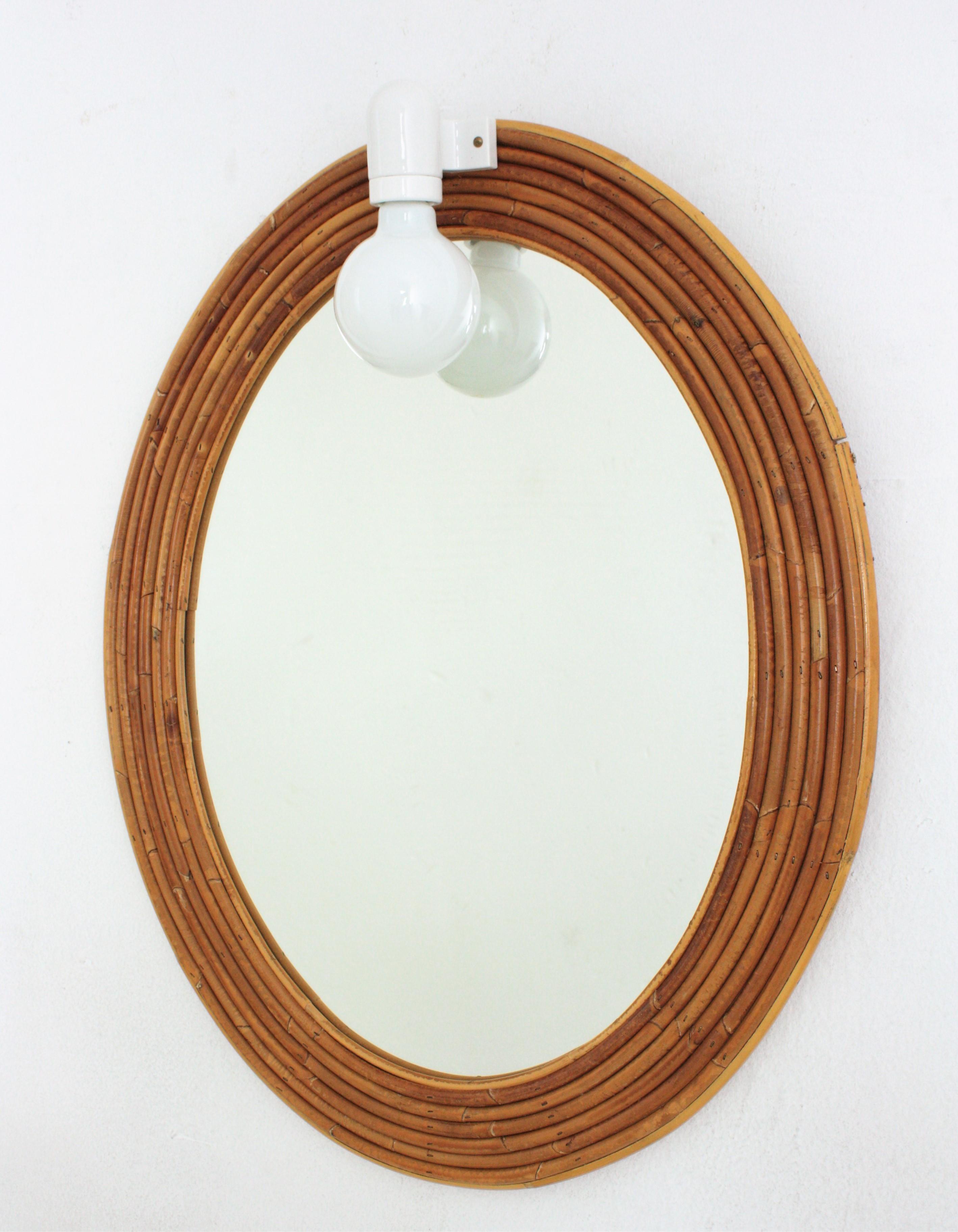 Cane Vivai del Sud Rattan Oval Mirror with Wall Light For Sale