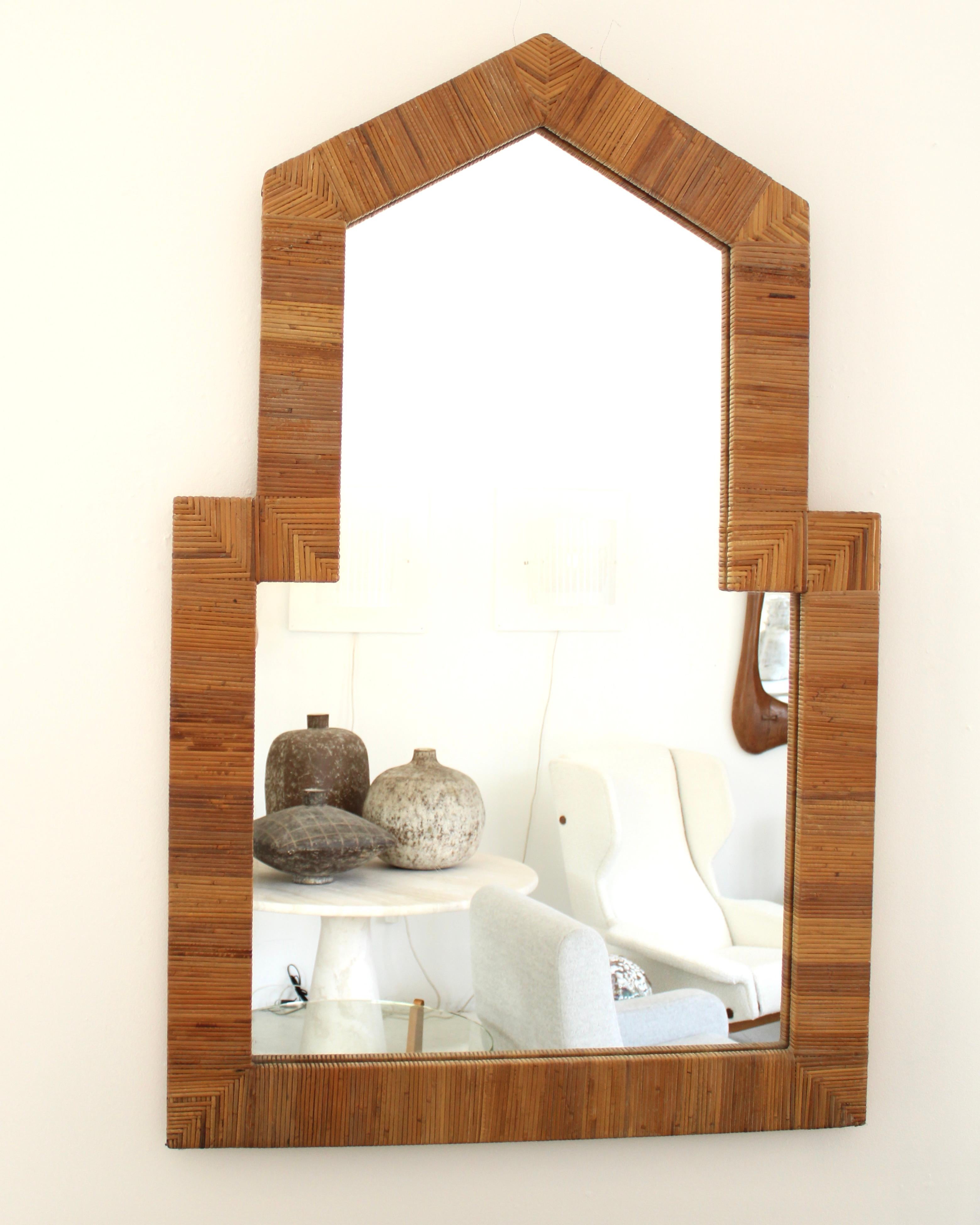 Vivai Del Sud Roma rattan or bamboo wall mirror. 
It's entirely handmade and quite unique and beautiful. 
Vivai Del Sud was a renowned brand in Roma in the 1960s and 1970s, inspired by Gabriella Crespi. Perfect condition with no breaks to the