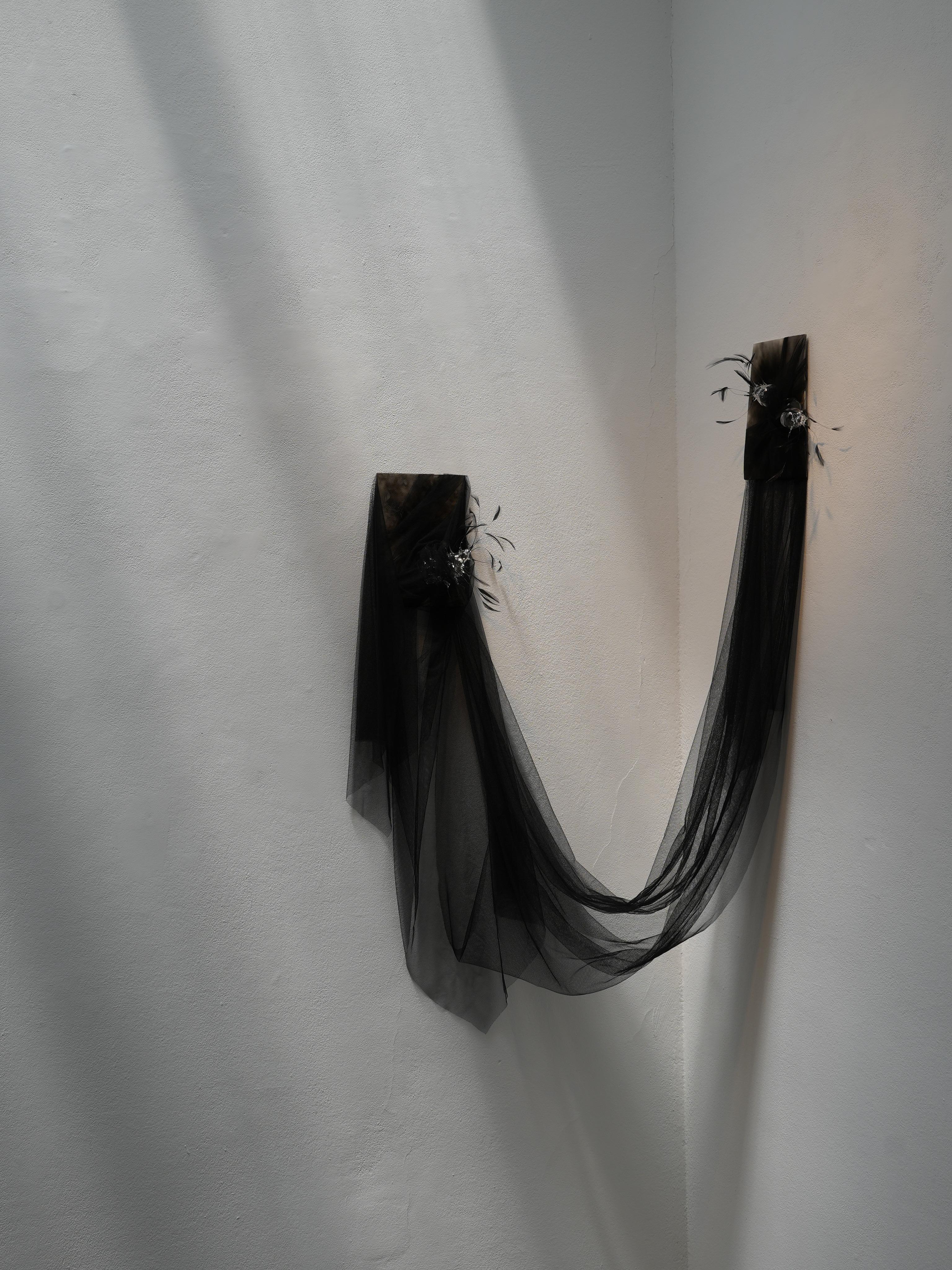 Feather and Glass Installation Artwork “Suspended Whispers” by Vivian Alarcón