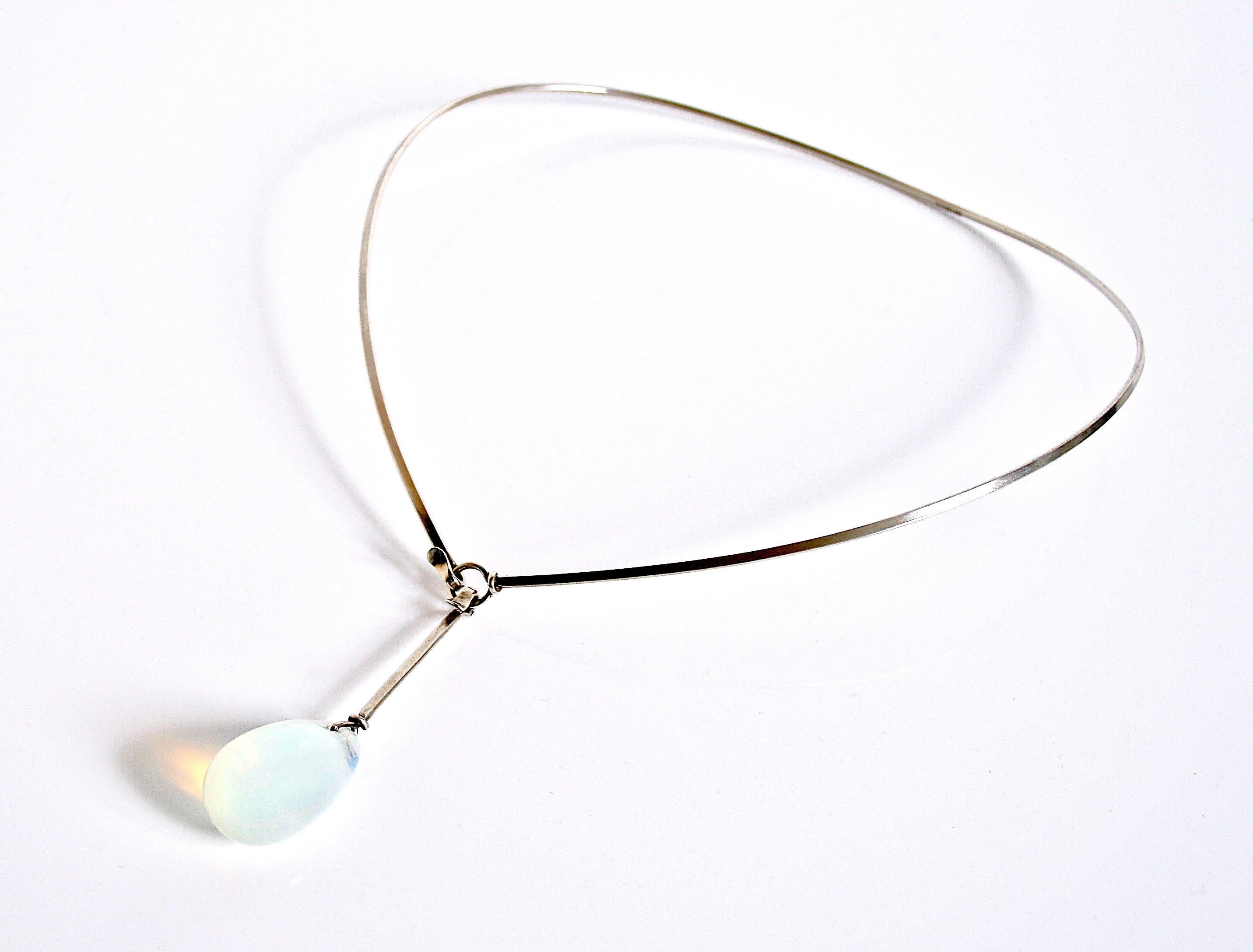 Early Vivianna Torun Bulow-Hube sterling silver & glass drop neckring made in her own workshop in Biot France. Very rare item marked Torun with French hallmarks. The drop is a spectacular colour milky blue/white looks like moonstone. Her early work