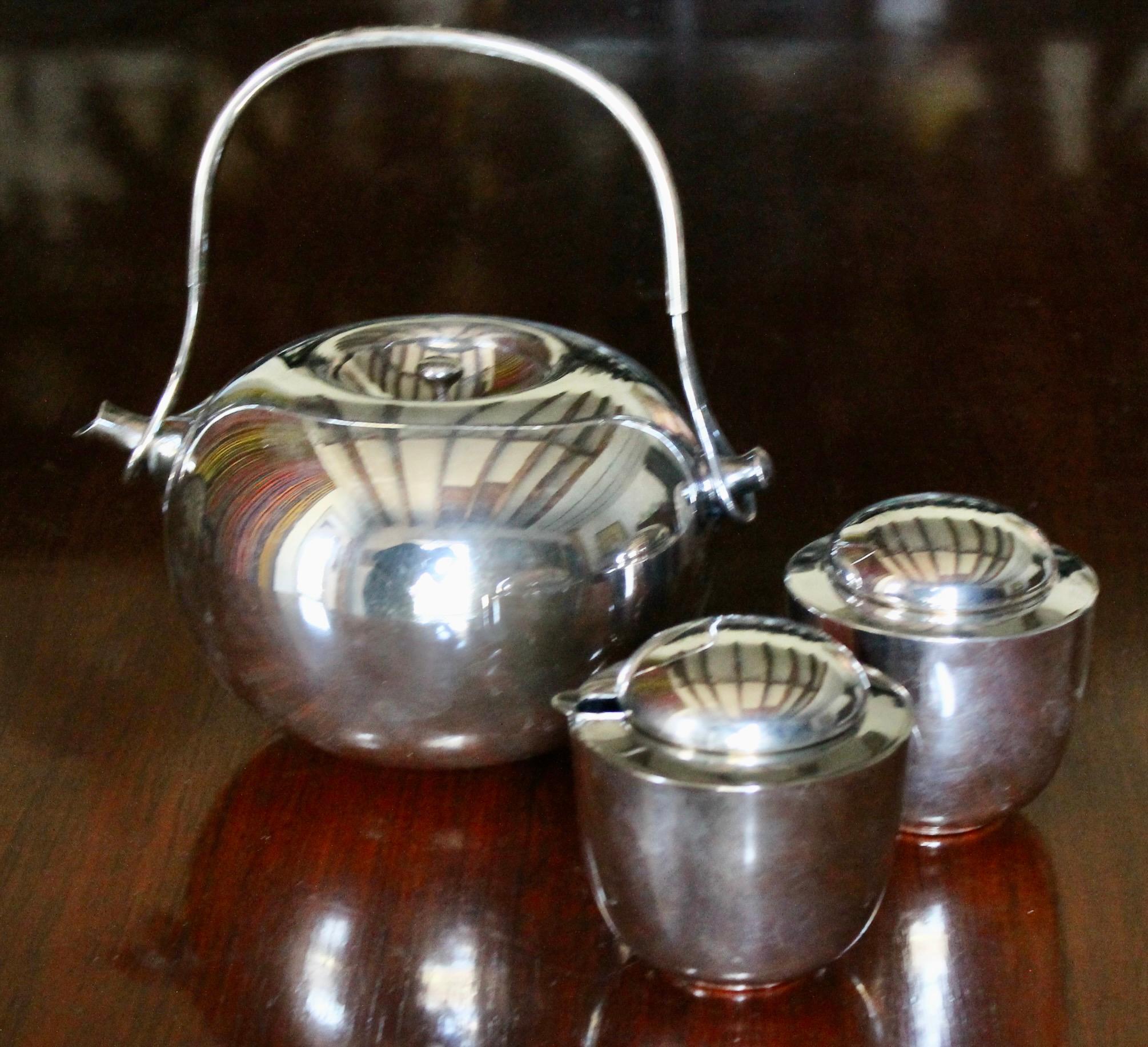 Silver Plated Brass Tea Pot (with strainer) and Sugar/ Creamer. Designed by Vivianne Torun Bulow-Hube for Dansk International.  And produced from 1960-69. Perhaps the rarest and most sort after of all the great Dansk productions.