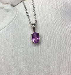 Vivid 0.69 Carat Ceylon Purple Pink Sapphire 18 Karat Gold Solitaire Pendant