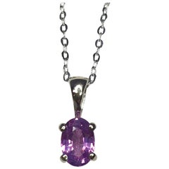 Vivid 0.69 Carat Ceylon Purple Pink Sapphire 18 Karat Gold Solitaire Pendant