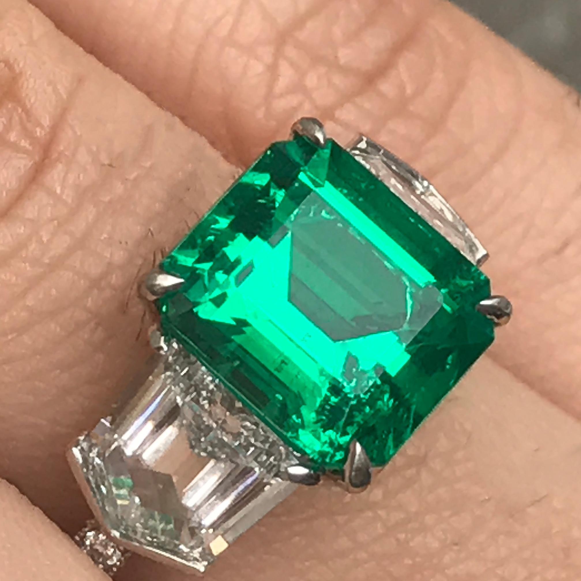 B8099001

Ring May be made to order from scratch to accommodate your exact finger size 
or a different stone if the budget requires it, takes approximately 3-6 weeks

Setting with no center stone can be purchased also.

Center Stone Emerald Details