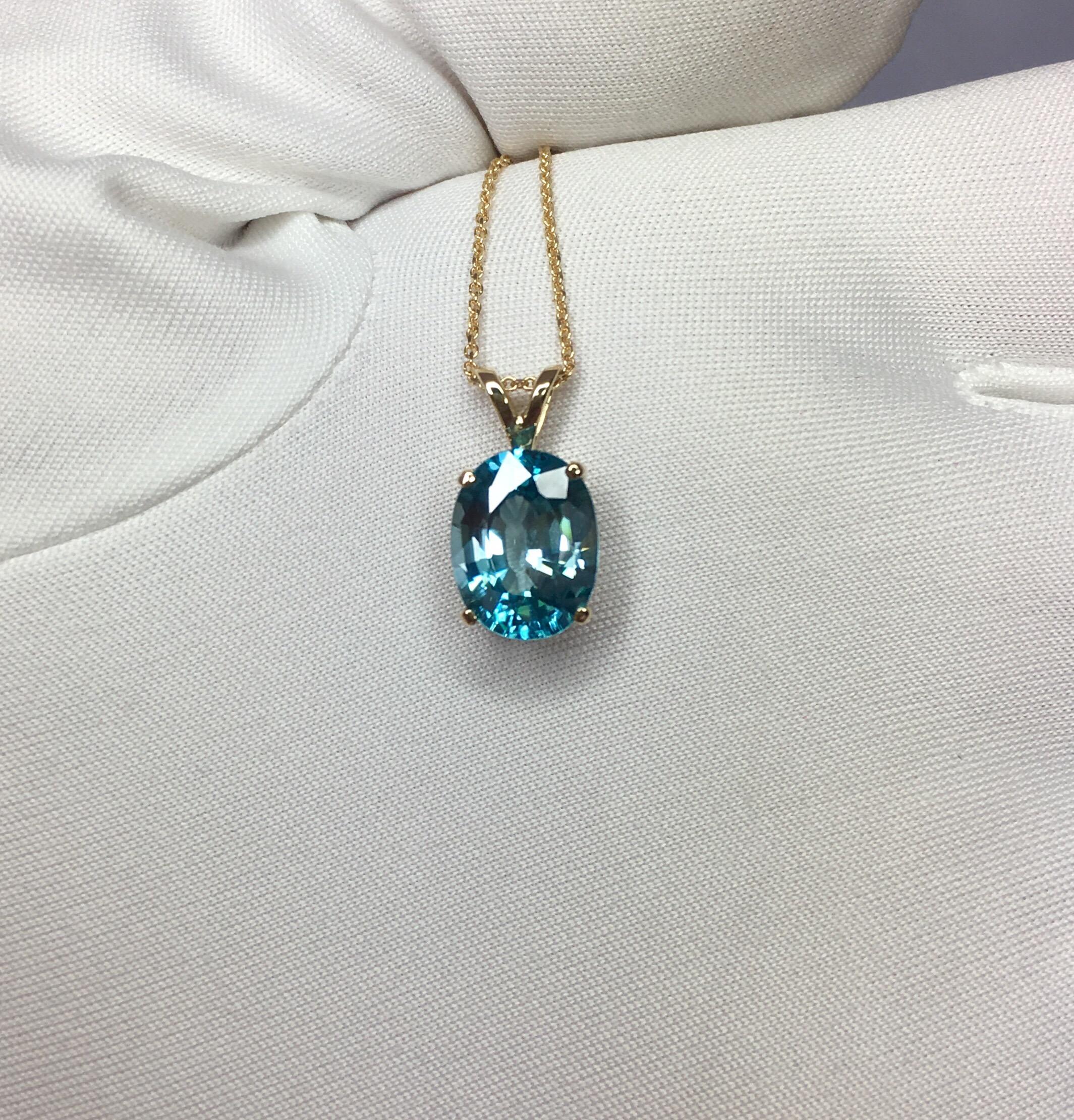 Beautiful natural large 4.31 carat blue zircon.
Set in a fine 14k yellow gold solitaire pendant.

Stunning blue zircon with a vivid neon blue colour and excellent clarity, practically flawless.

It also has an excellent oval cut which shows lots of