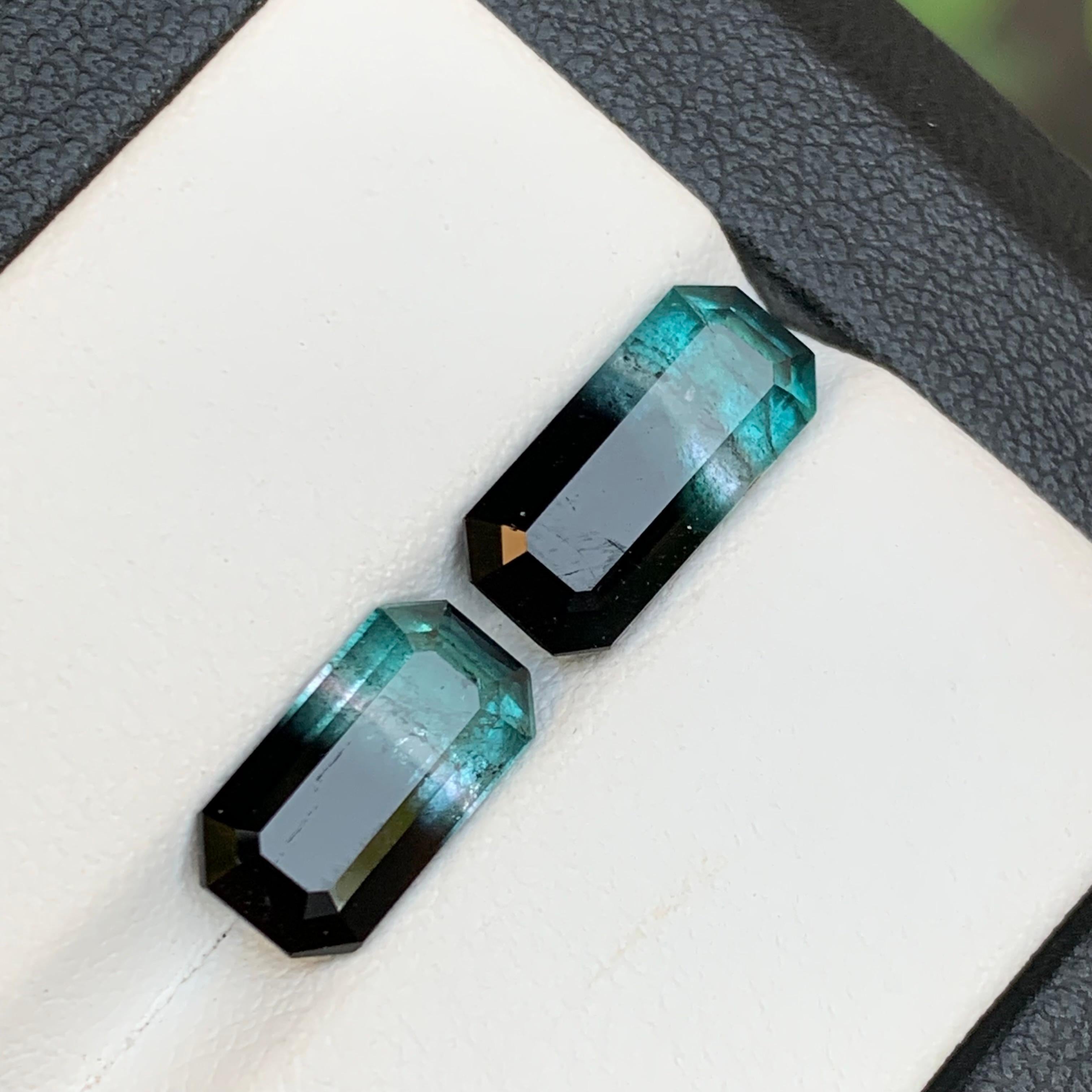 Vivid Blue and Black Bicolor Natural Tourmaline Loose Gemstones Set for Rings, Necklace Pendant in  Emerald Cut from Afghanistan!!

💎 GEMSTONE TYPE: Tourmaline
⚖️ WEIGHT: 5.30 Carat
🪚 SHAPE & CUT: Emerald Cut
📏 SIZE (MM): 
3.05 Ct (12.33 x 5.83 x