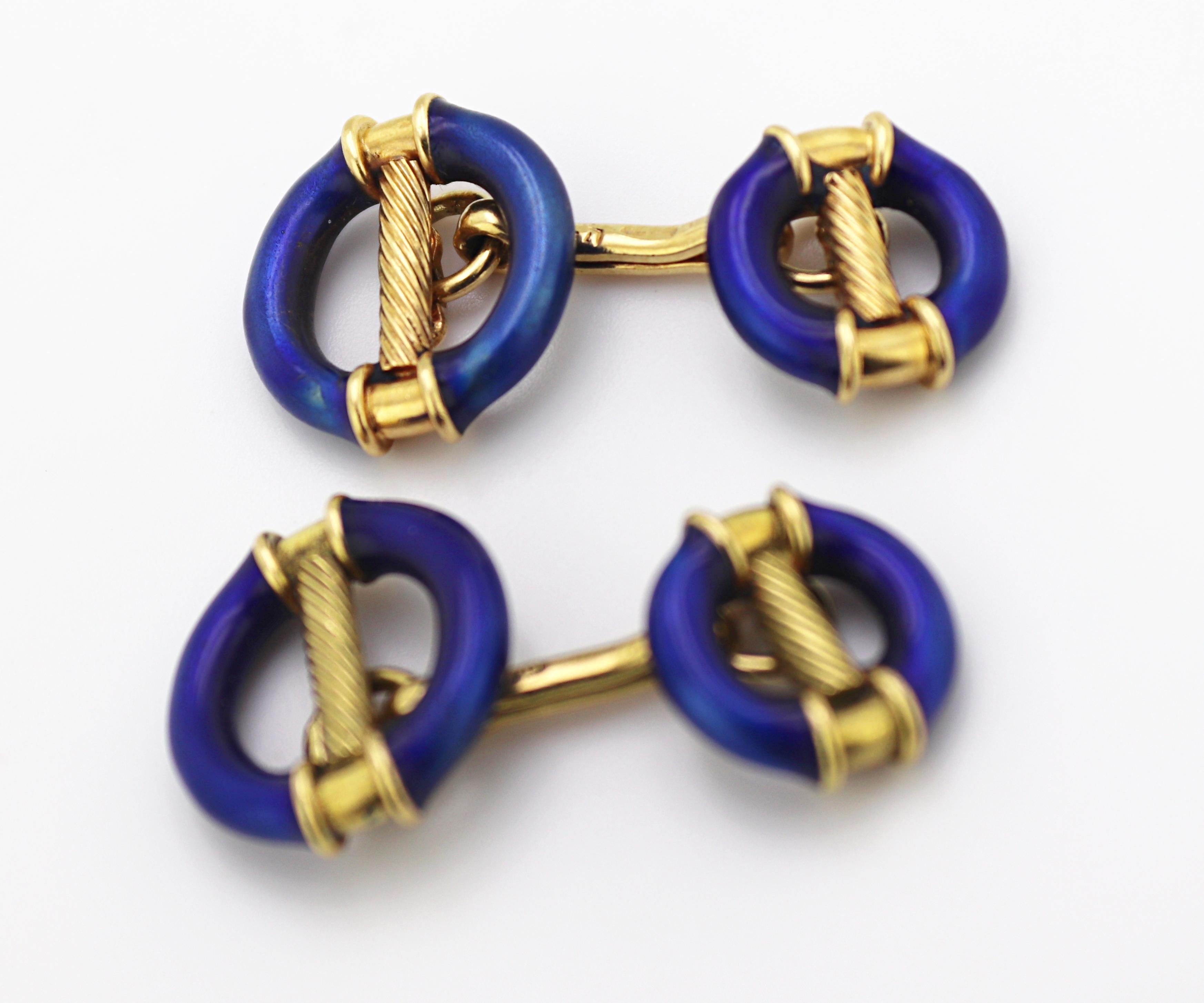 These double sided geometric and industrial cable motif links feature a rich
cobalt blue enamel (some enamel loss), in 18k yellow gold, 14 mm to 12
mm X 25 mm, marked 750, Gross Weight 13.25 grams
Condition: Some enamel loss