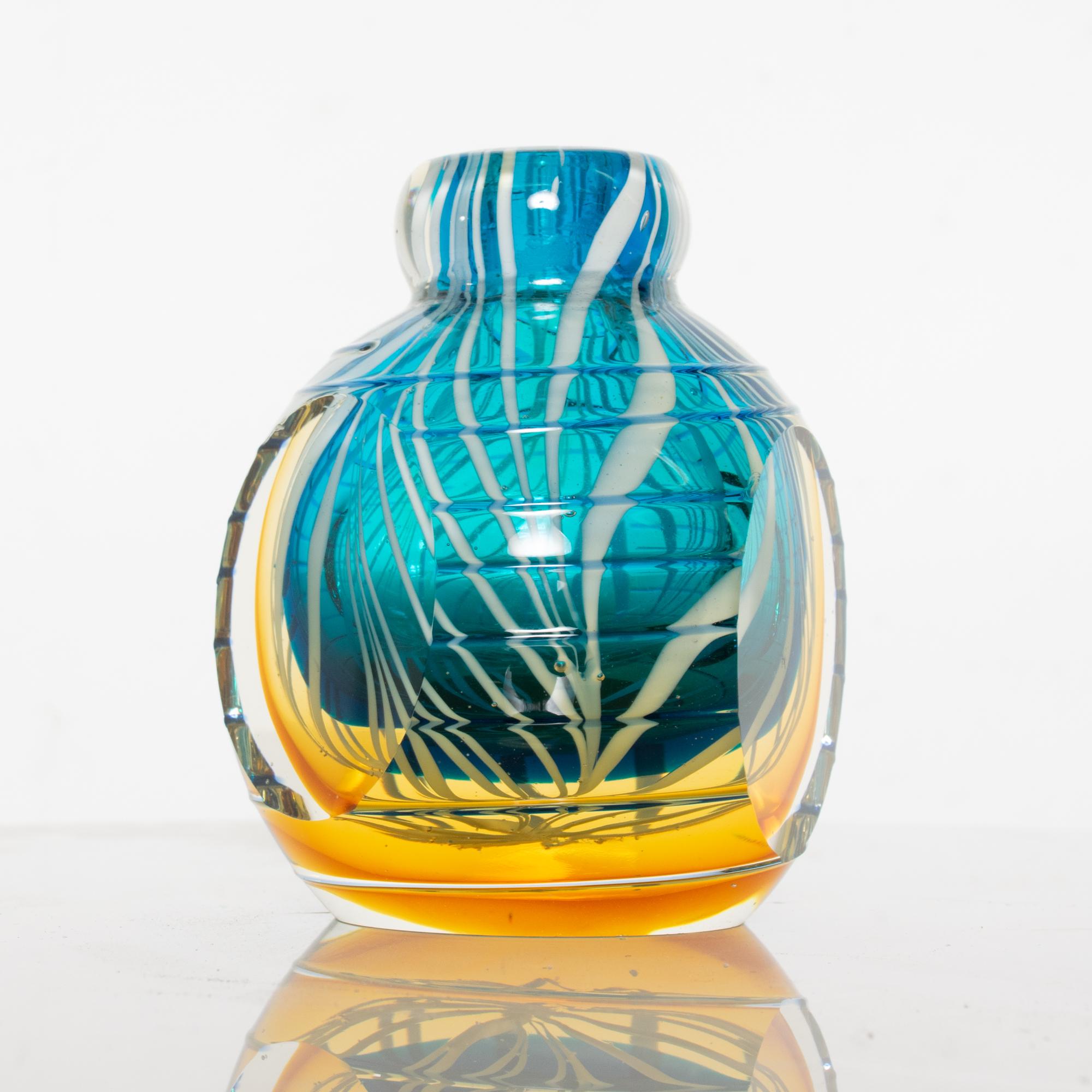 Lovely vivid blue gold and white swirled Venetian vase vintage magical hand blown Murano glass, Italy.

Difficult to read maker stamp attributed to Murano, Italy, circa 1970s

Dimensions: 5