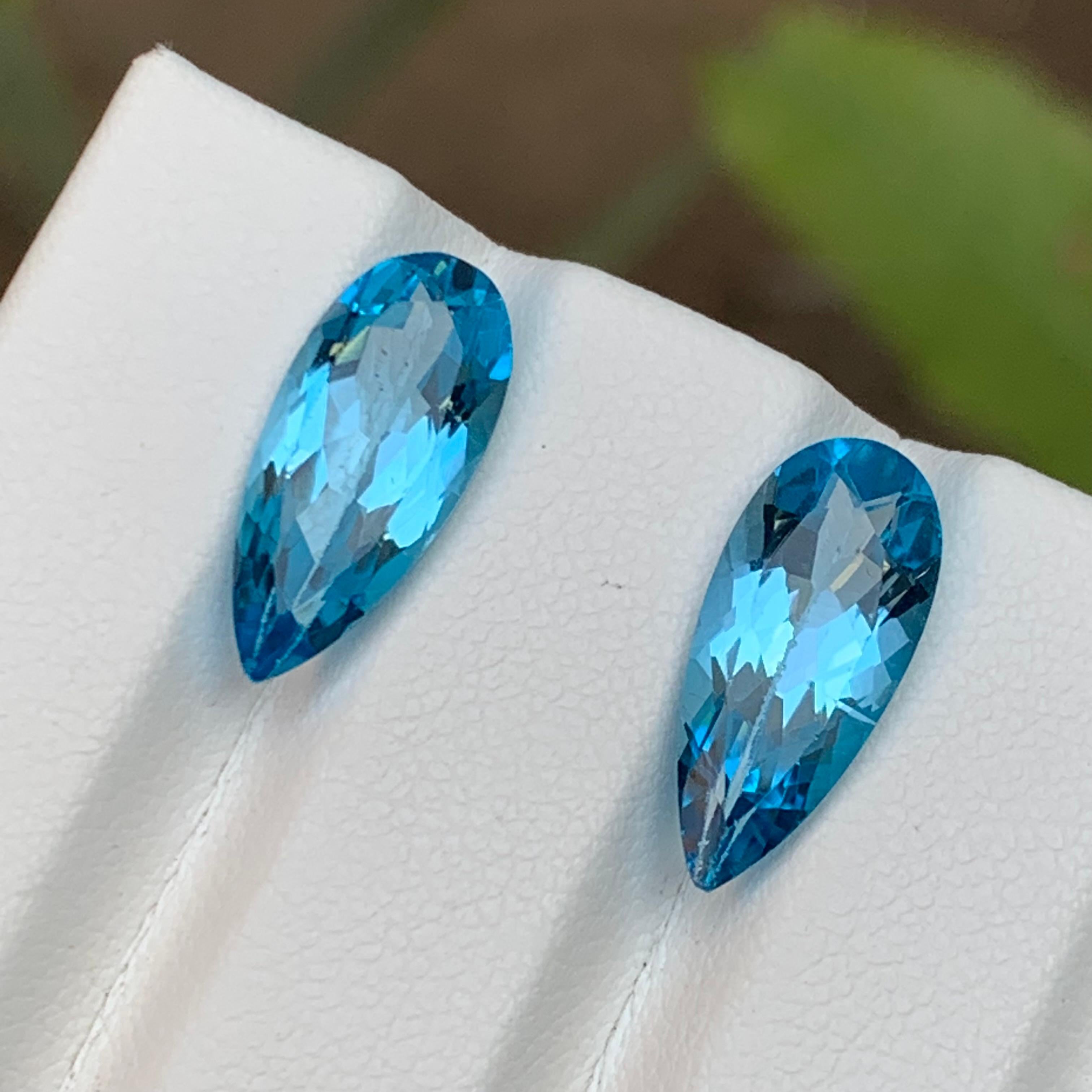 Contemporary Vivid Blue Natural Swiss Topaz Loose Gemstone Pair for Earrings 8.90 Ct Pear Cut For Sale
