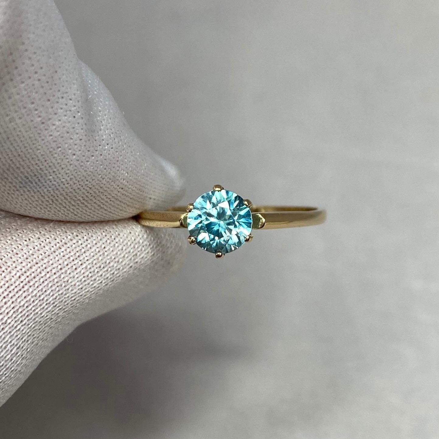 Stunning Vivid Blue Zircon 14k Yellow Gold Solitaire Ring.

1.26 Carat Zircon with a beautiful vivid blue colour and very good clarity, some small natural inclusions visible when looking closely but not a dirty stone.
Also has an excellent round