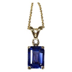 Vivid Blue Violet Tanzanite and Diamond Yellow Gold Pendant Necklace Emerald Cut