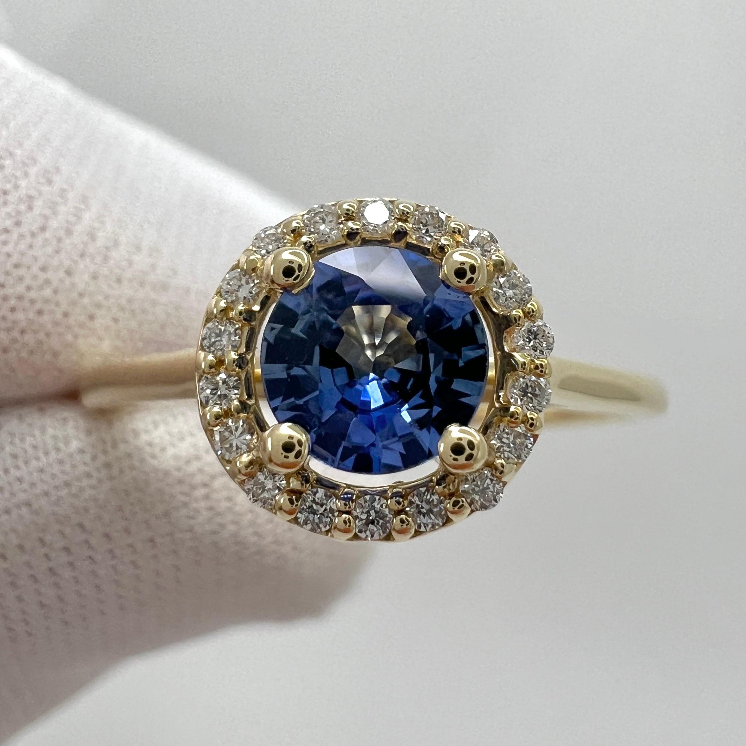Vivid Bright Blue Ceylon Sapphire And Diamond Round Cut 18k Yellow Gold Halo Ring

Stylish modern halo ring featuring a fine natural vivid blue Ceylon sapphire with a carat weight of 0.54ct. This sapphire has an excellent round cut and excellent